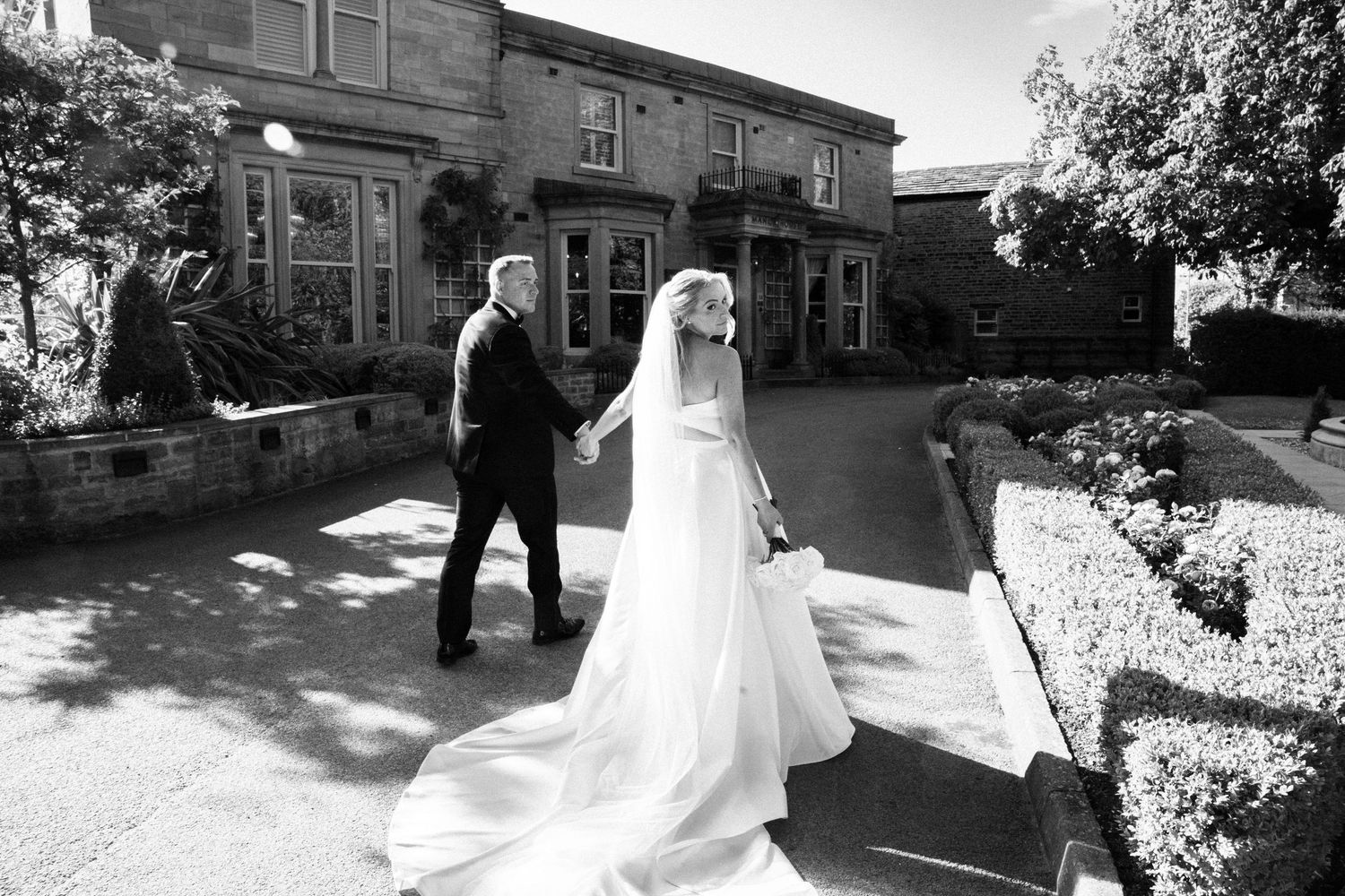Documenting couples portraits naturally at Manor House Lindley by Manchester wedding photographer Tina Hevingham.