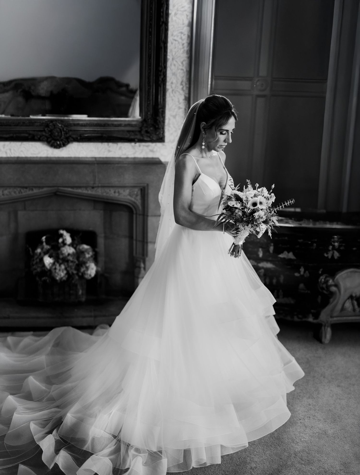 Bride having a quiet moment on her own before the ceremony at Mitton Hall Clitheroe by Manchester wedding photographer.