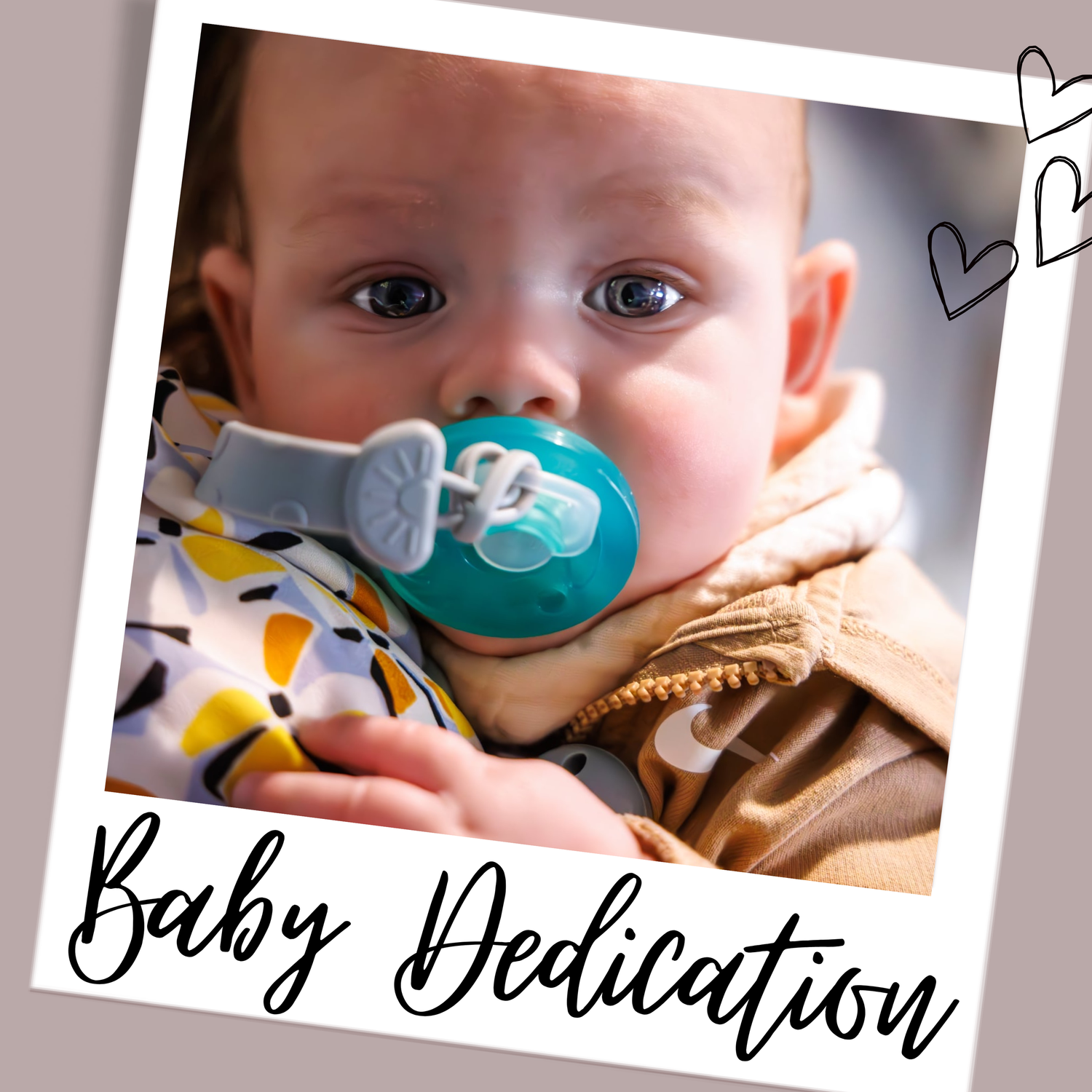 Framed photo of an infant with teal pacifier and Baby Dedication text with decorative hearts.