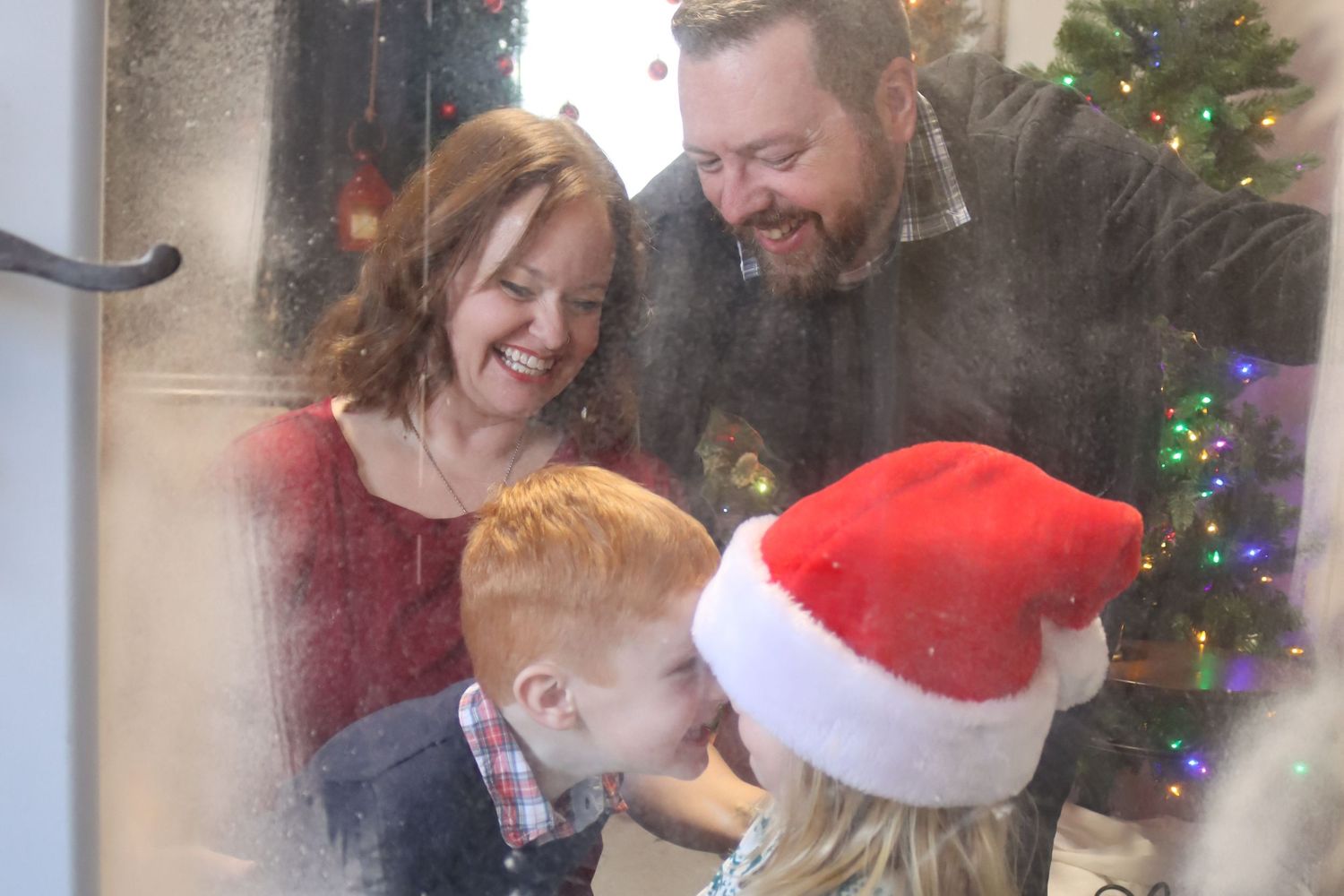 A cozy indoor Christmas setting with decorated trees and festive holiday decor.