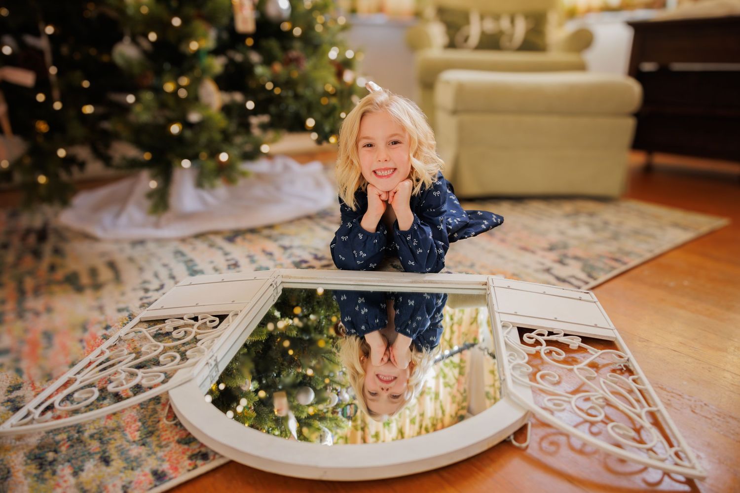 Christmas decorations and lights create a warm holiday atmosphere in a cozy living room setting.