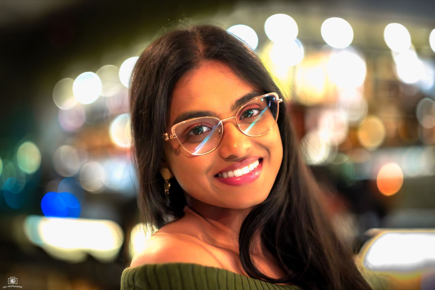 Nighttime portrait series with bokeh lights creating a dreamy atmosphere.