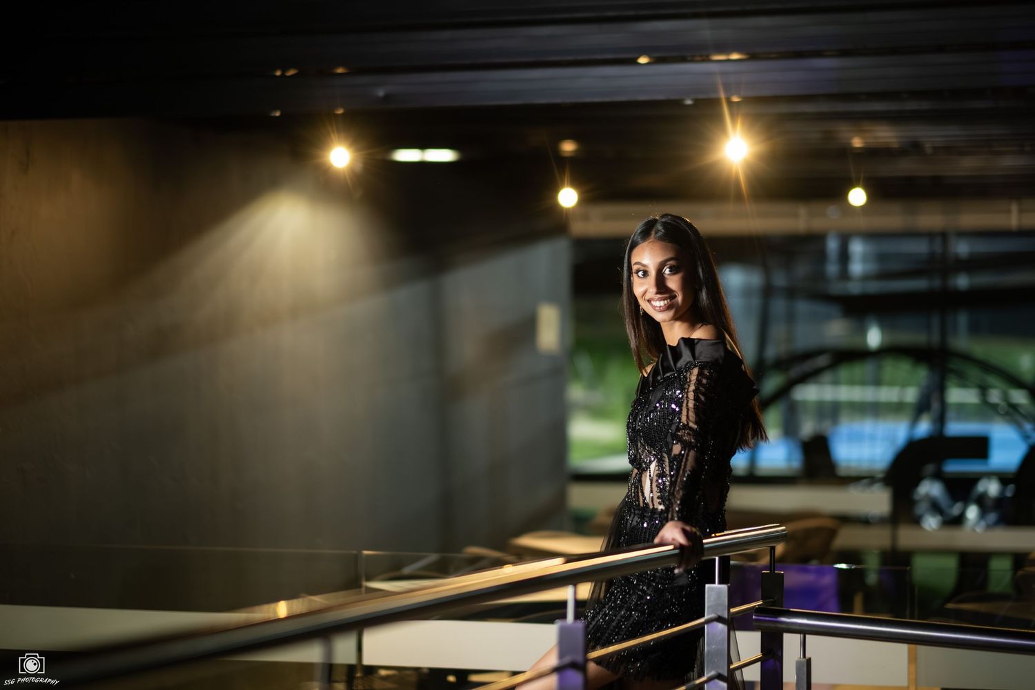 Moody indoor photography session with dramatic lighting and shadows.