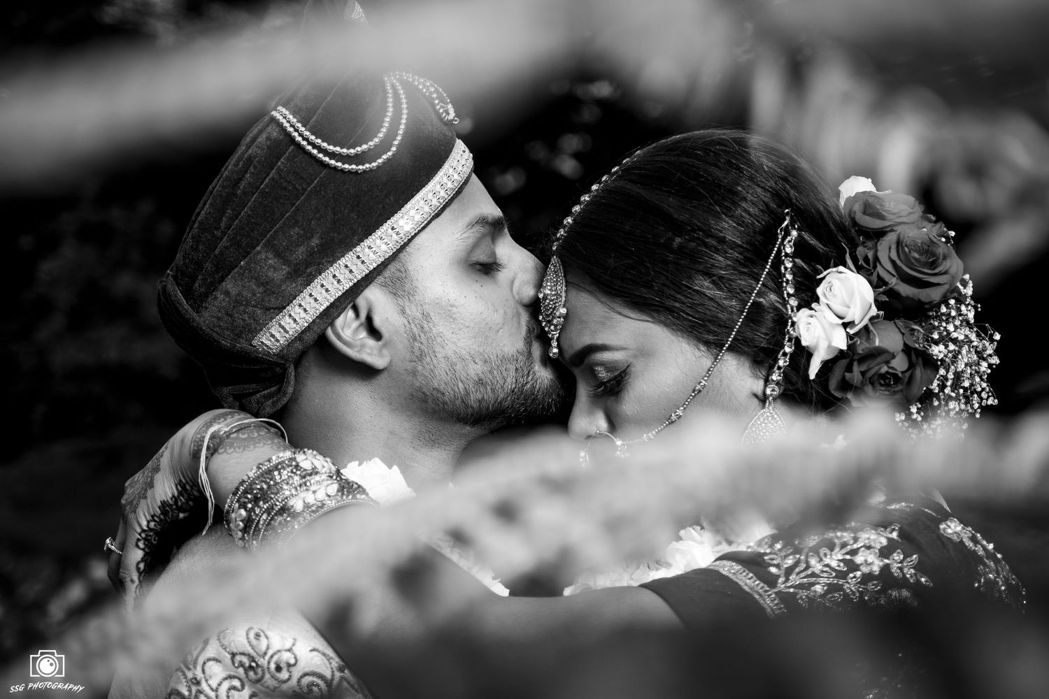 Artistic black and white wedding photography with romantic close-up shots.