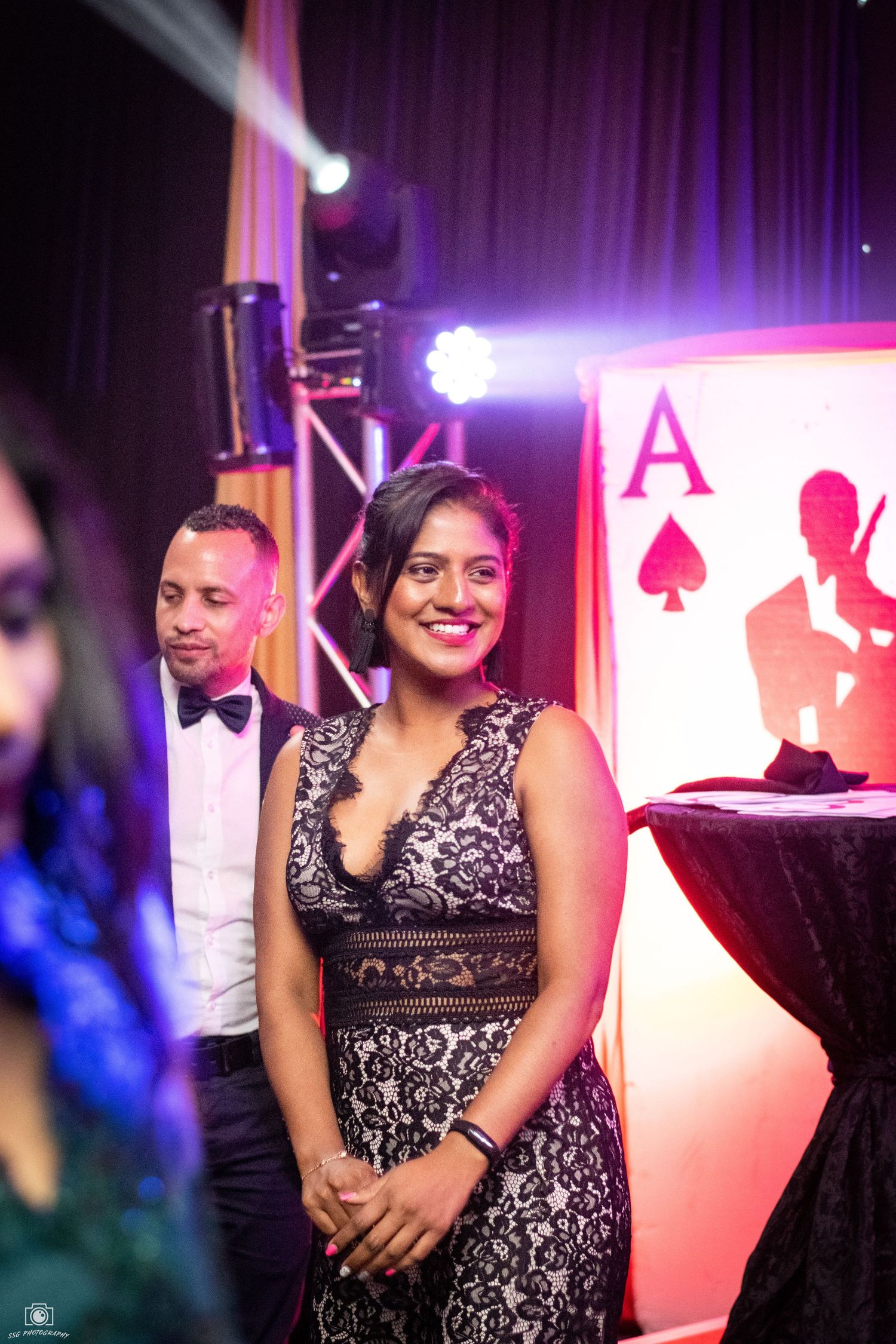 Elegant casino-themed event with black and white decor and playing card motifs.