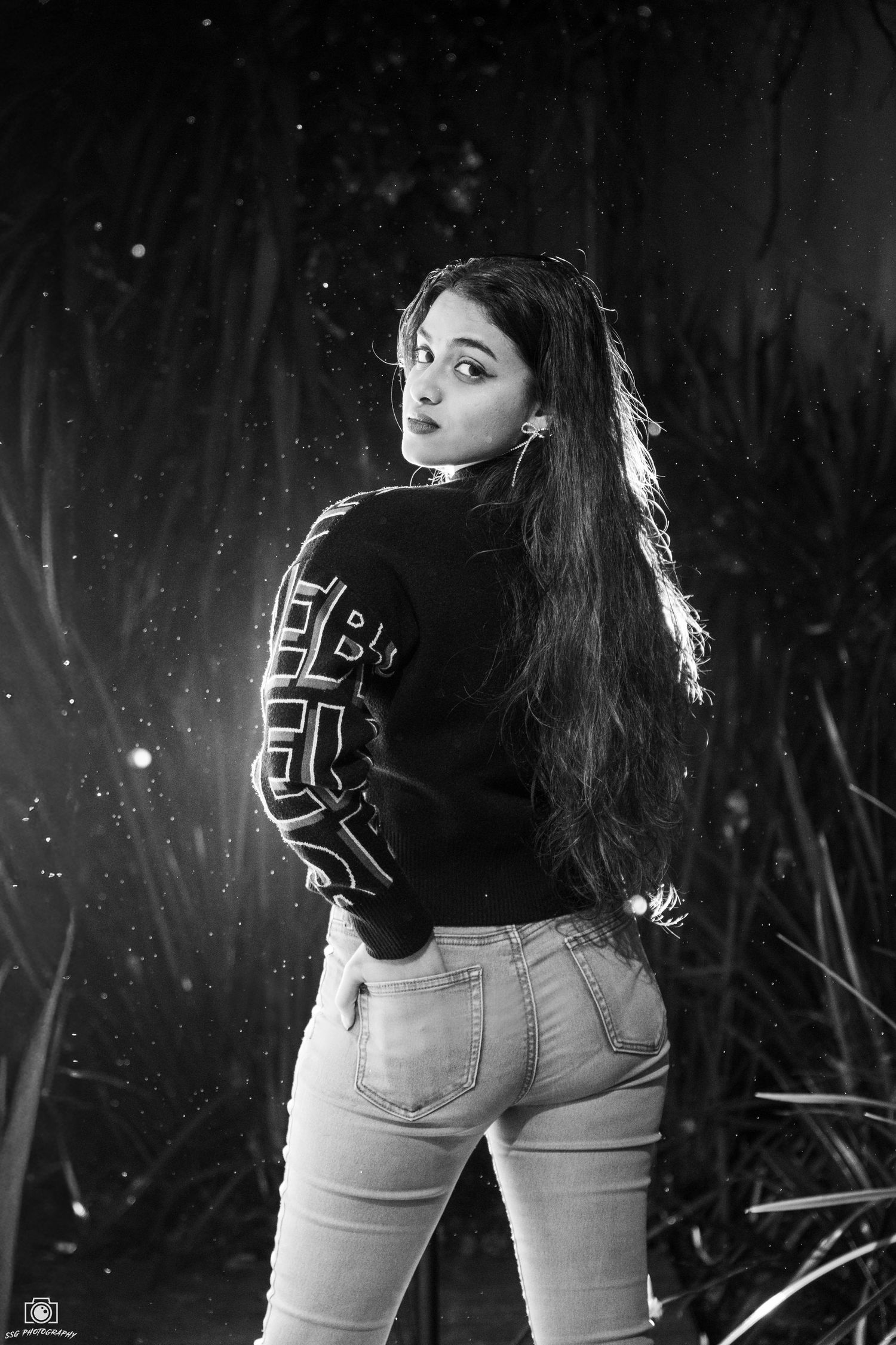 Artistic nighttime portrait series with sparkles and dramatic backlighting.