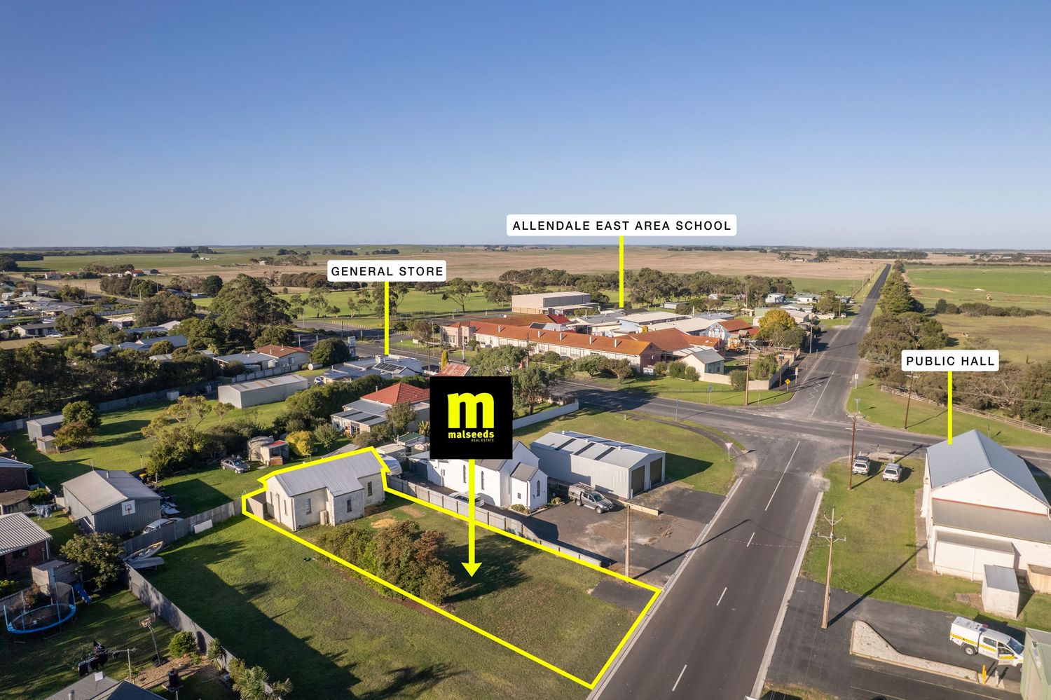 Aerial view of Allendale East, SA, showing general store, public hall, and Allendale East Area School near a rural intersection.