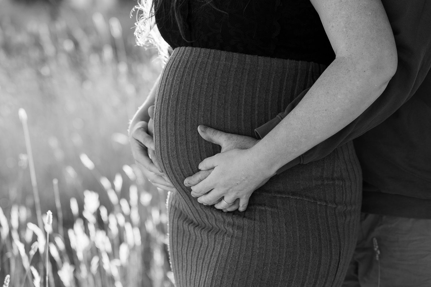 Close-up portrait shot in black and white with natural lighting.