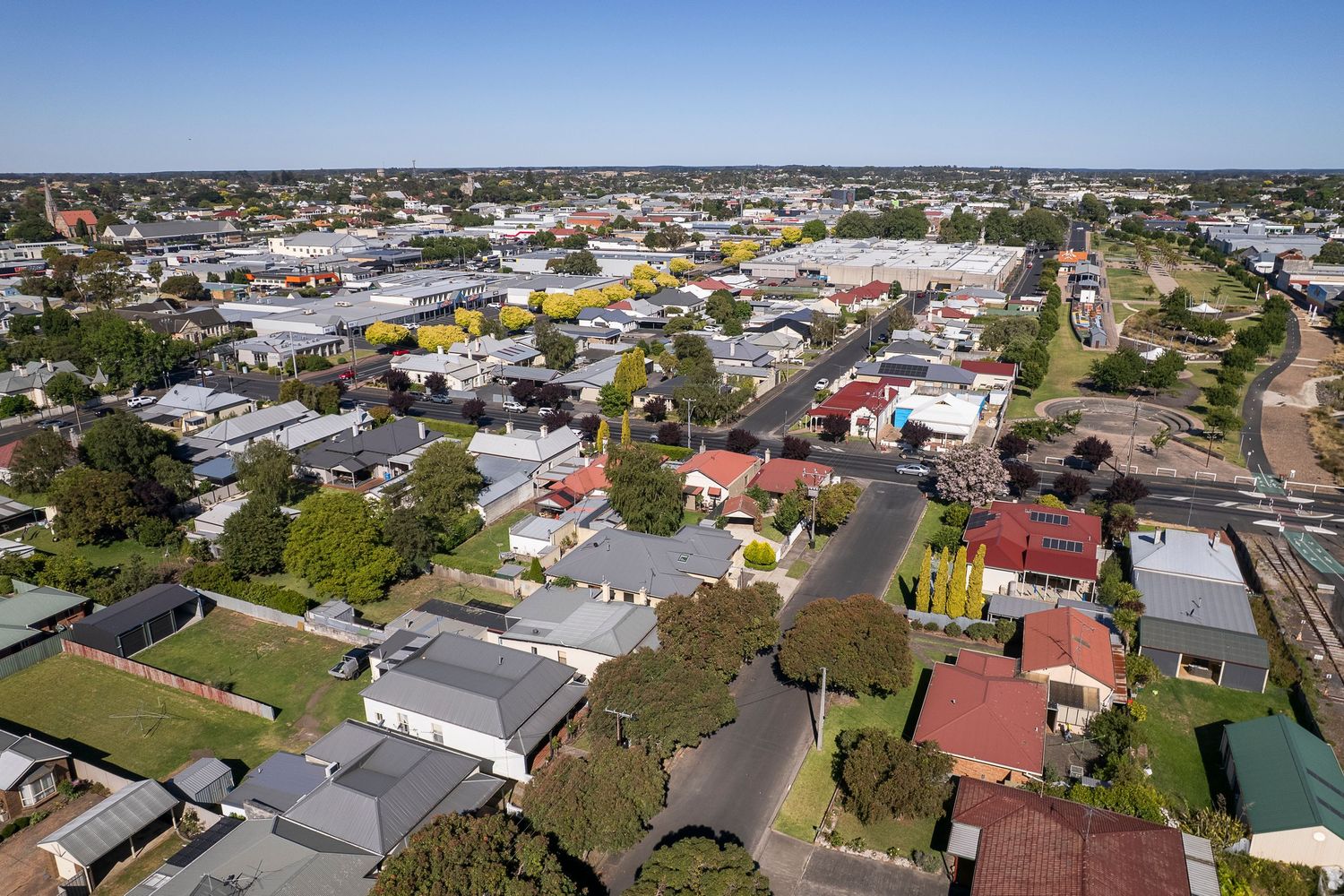 Aerial view of suburban neighborhood showing residential streets and houses.