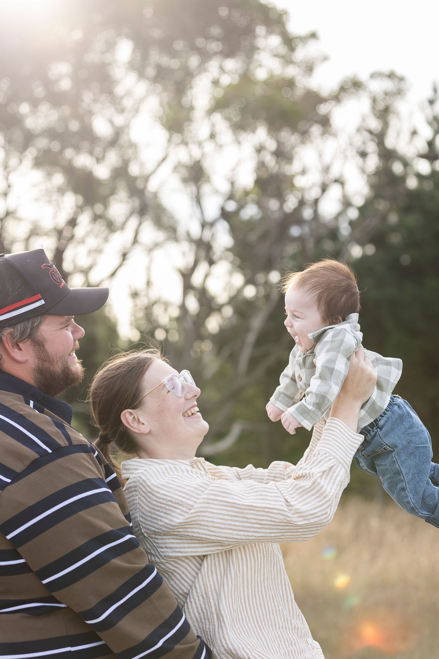 Candid outdoor sequence showing playful interactions in natural lighting at sunset.