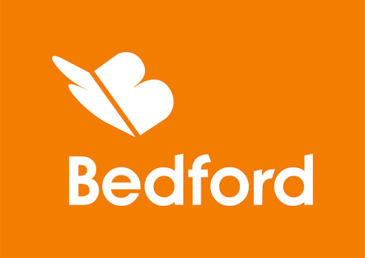 Bedford brand logo featuring a white butterfly and heart icon above bold white text on a vibrant orange background.