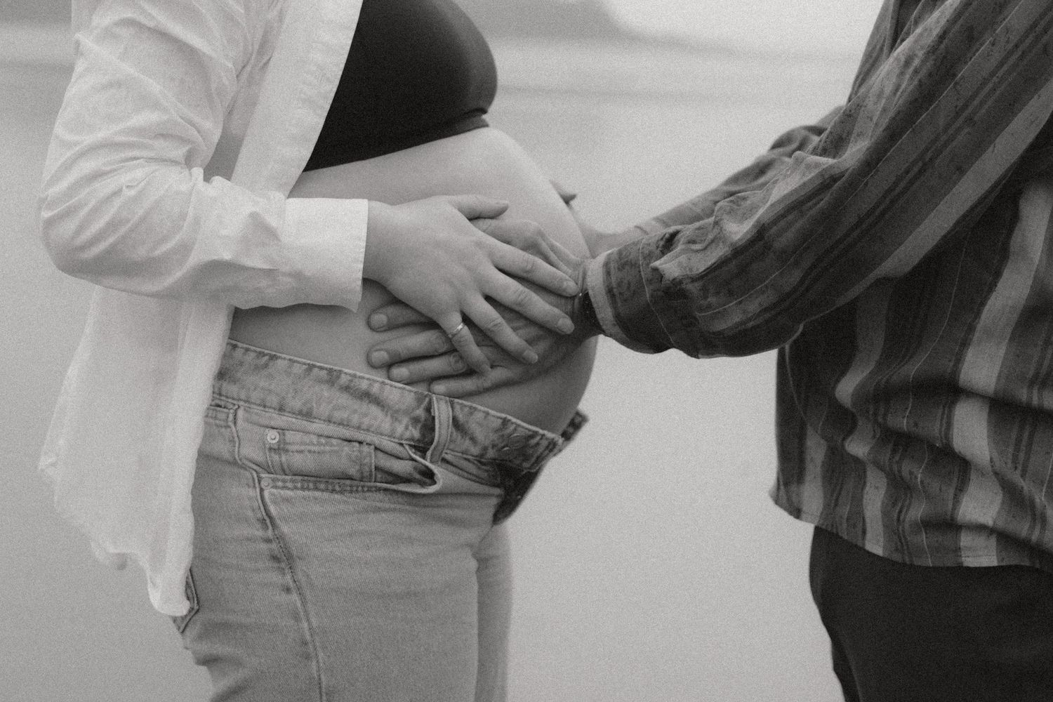 A series of black and white photos showing people's hands holding and passing objects.