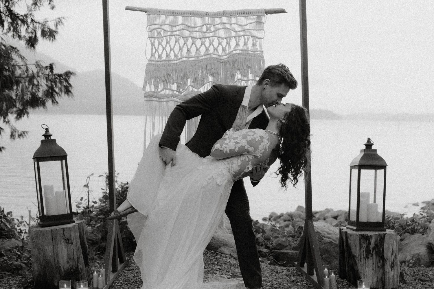 Tofino intimate nature wedding romantic black and white wedding scene with vintage lanterns in the background