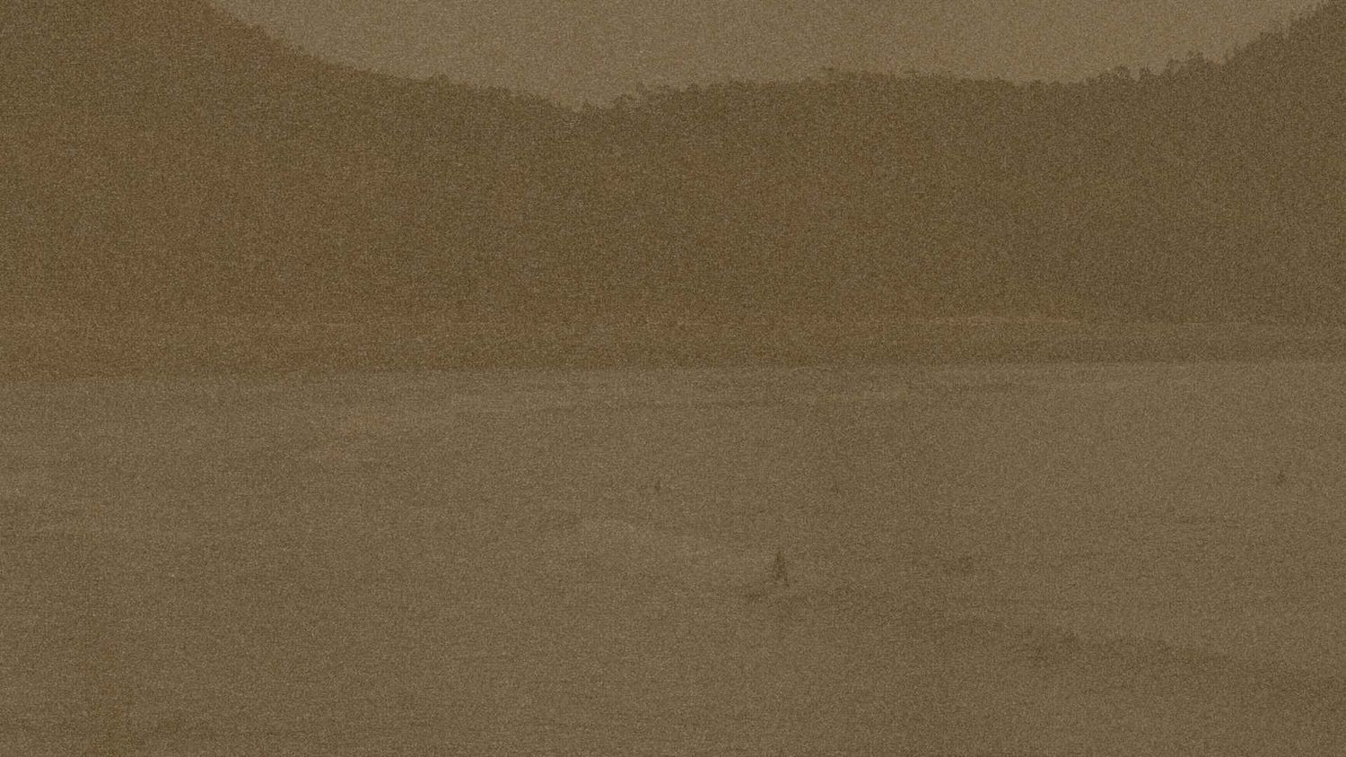 Tofino landscape with sepia-toned mountain silhouettes on Vancouver Island coast
