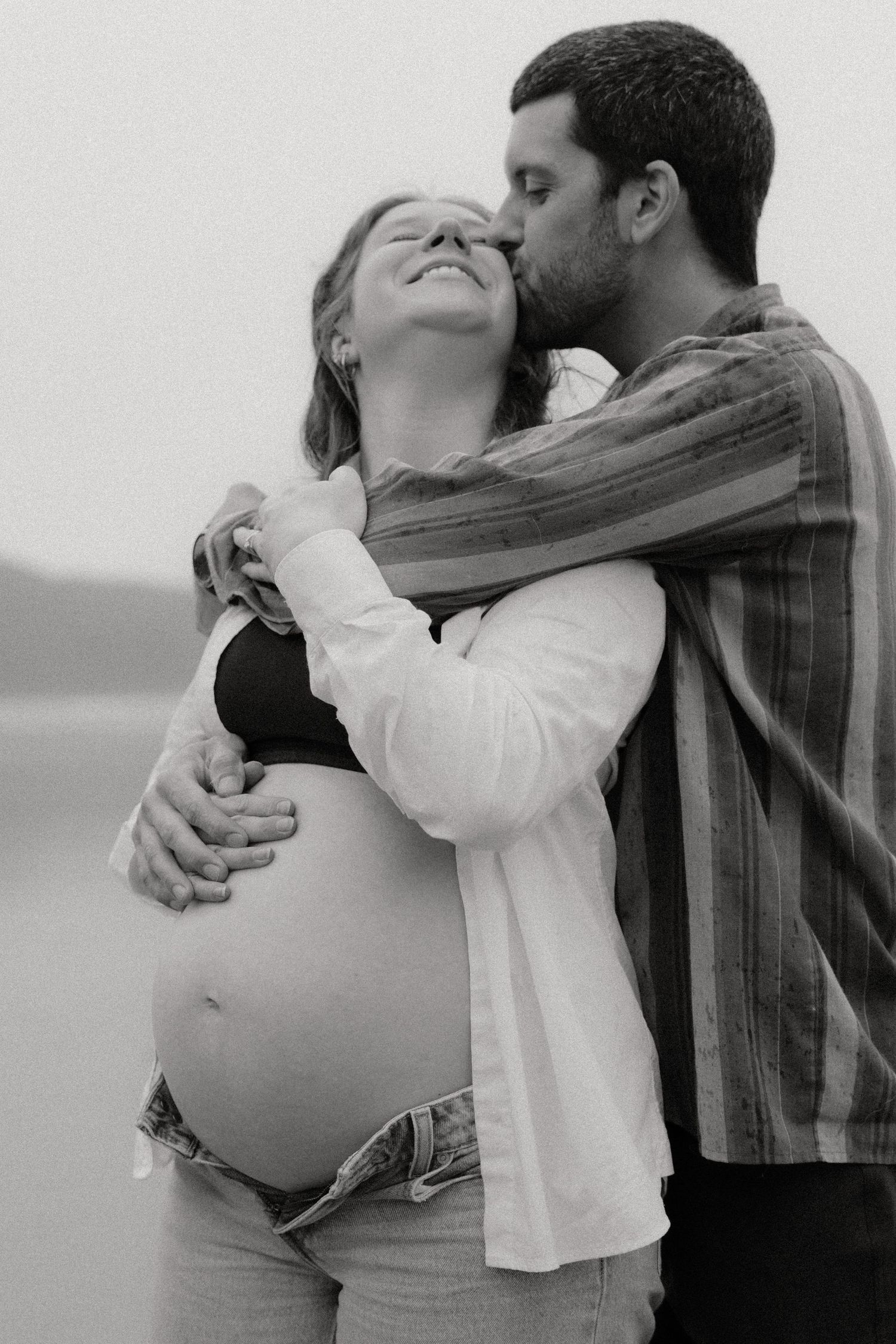 A romantic sequence of dance moves captured in monochrome on a cloudy day.