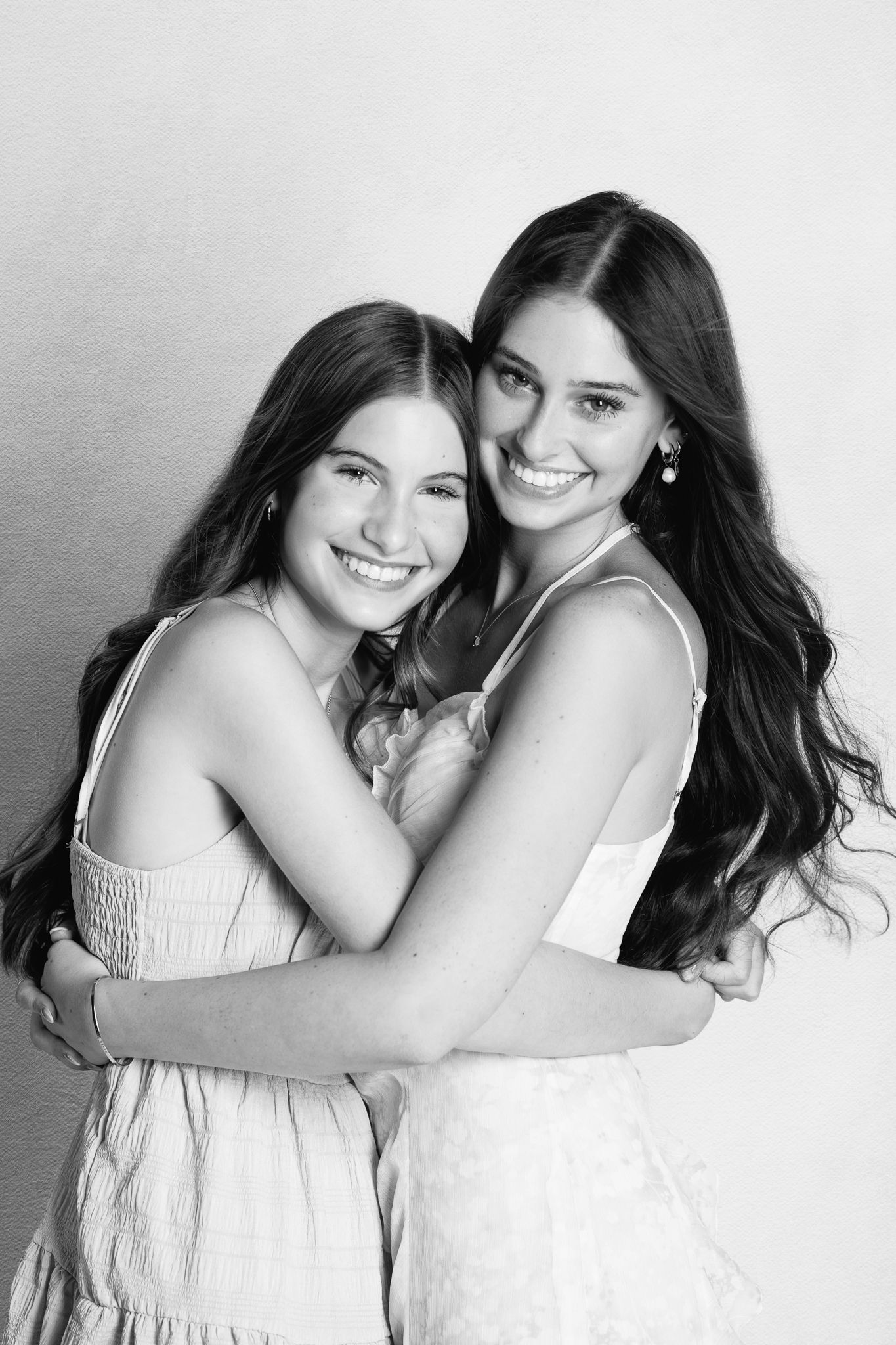 Black and white sibling portrait capturing connection by FRAMED photography in Ohio.