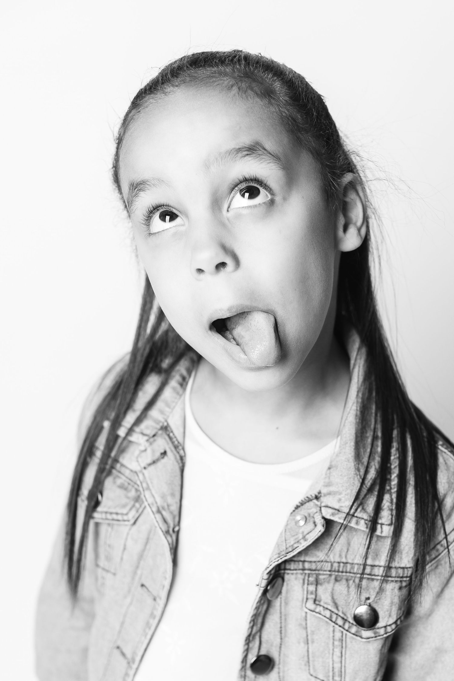 A personality portrait of a young girl being silly by FRAMED child photographer in Ohio.