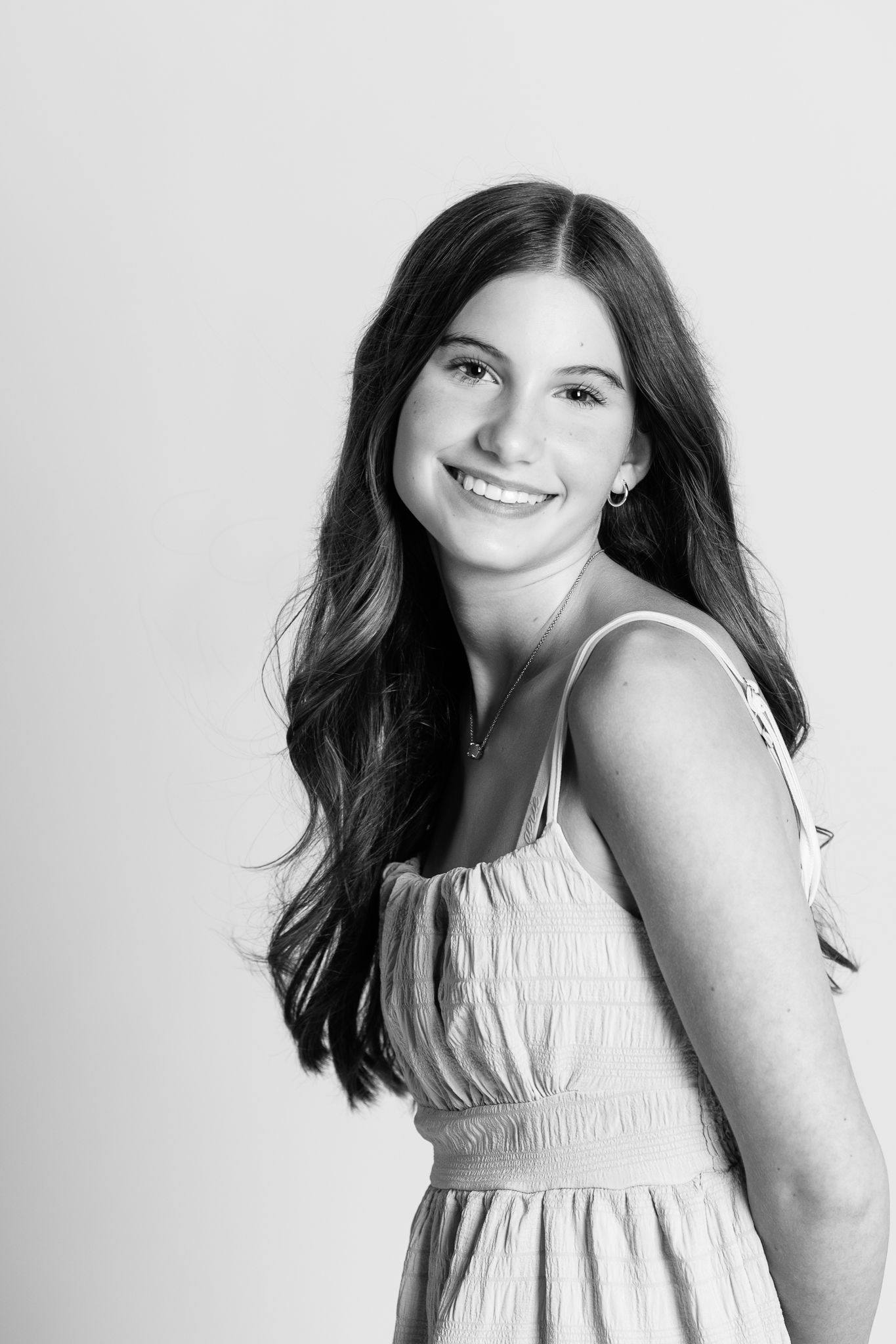 A portrait of a teen girl captured in black and white by FRAMED personality portraits in Ohio.