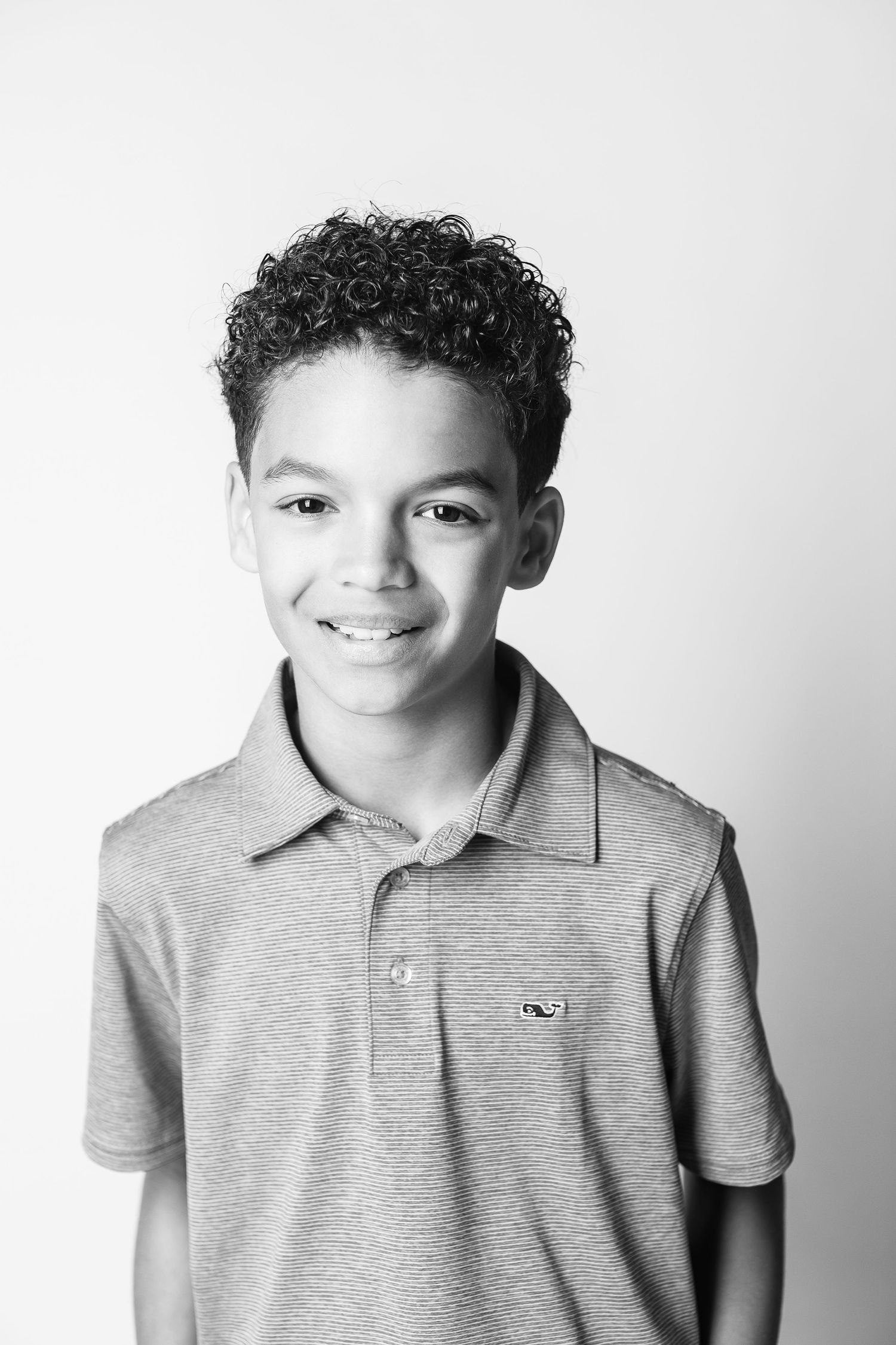 A classic portrait in black and white of a young boy by Northeast Ohio child photographer, FRAMED.