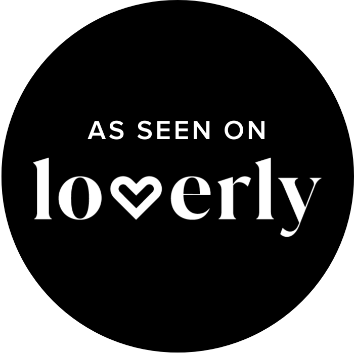 As seen on Loverly badge, black circle with white text and heart logo for wedding inspiration platform.