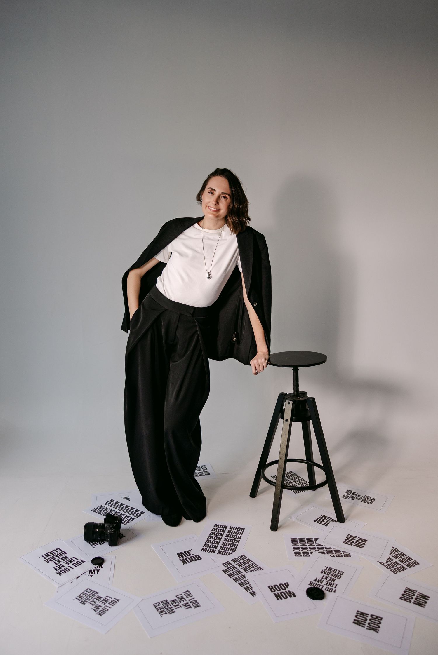 Artistic photo series showing movement and poses with scattered cards on studio floor.