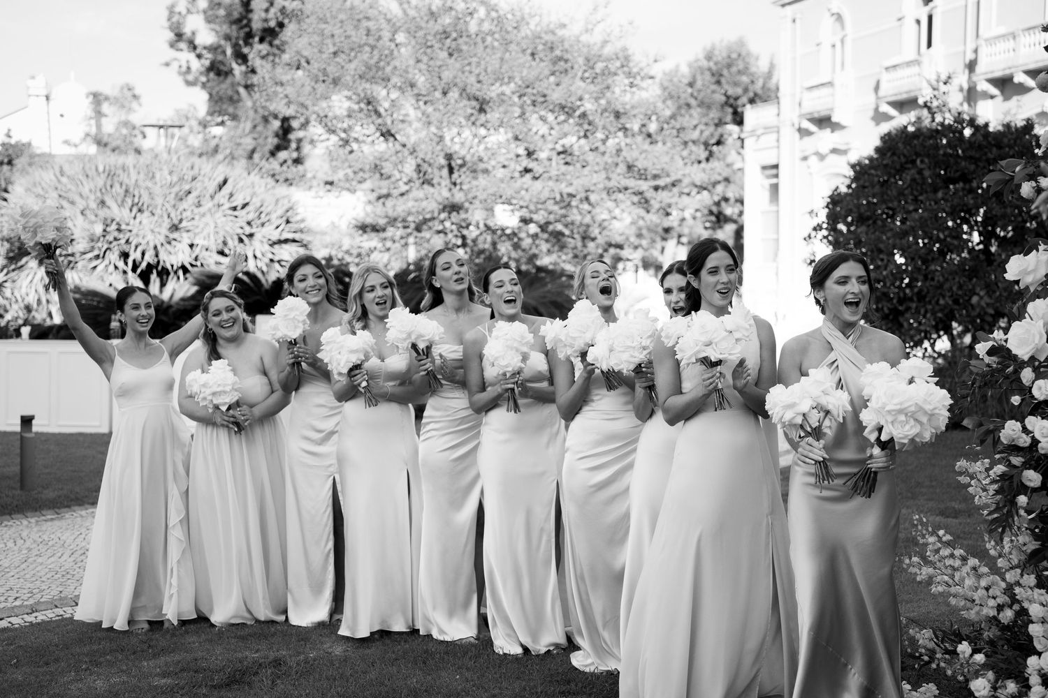 Group photos showing people in light-colored dresses posing together outdoors.