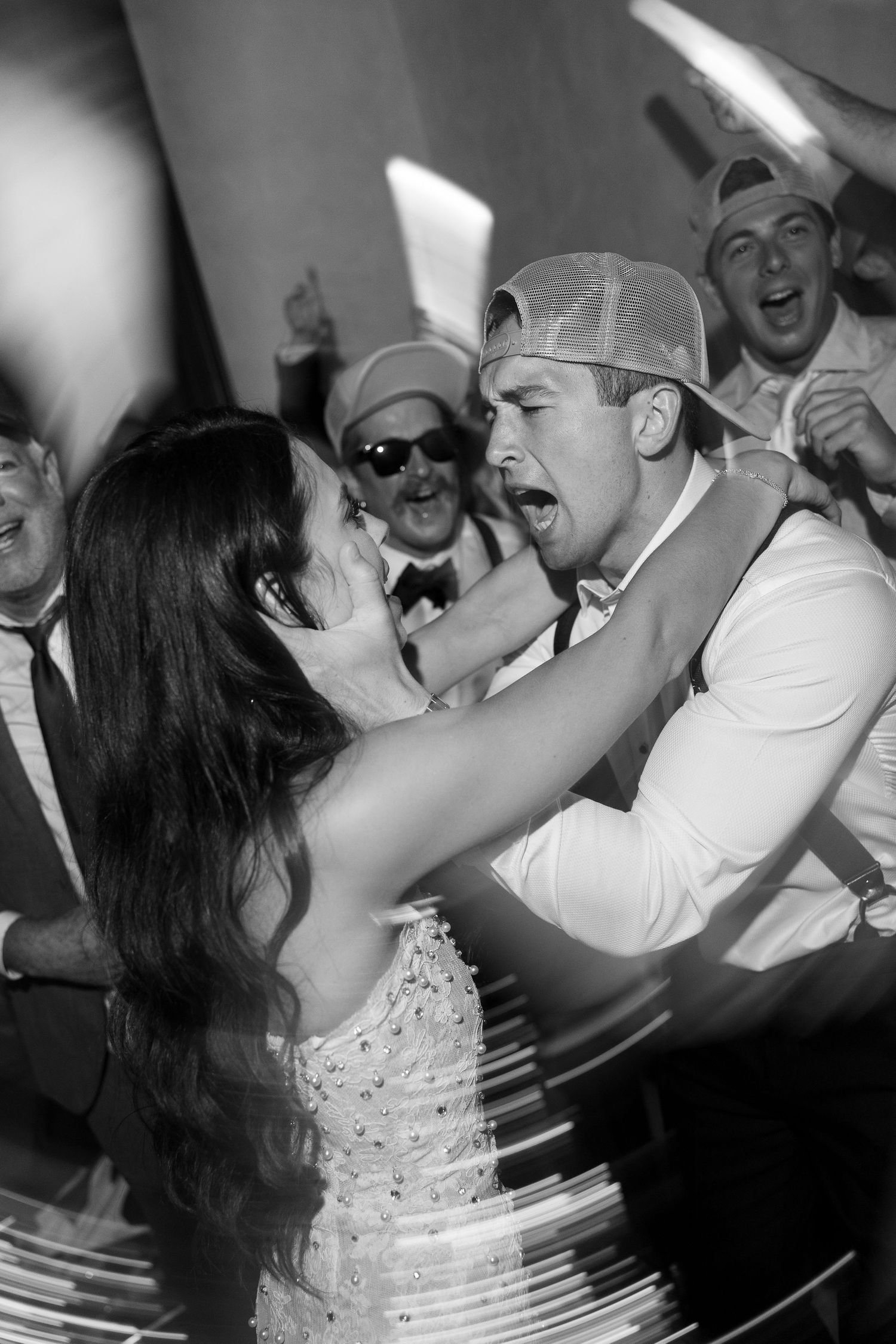 Energetic wedding celebration with guests dancing and enjoying the festivities.