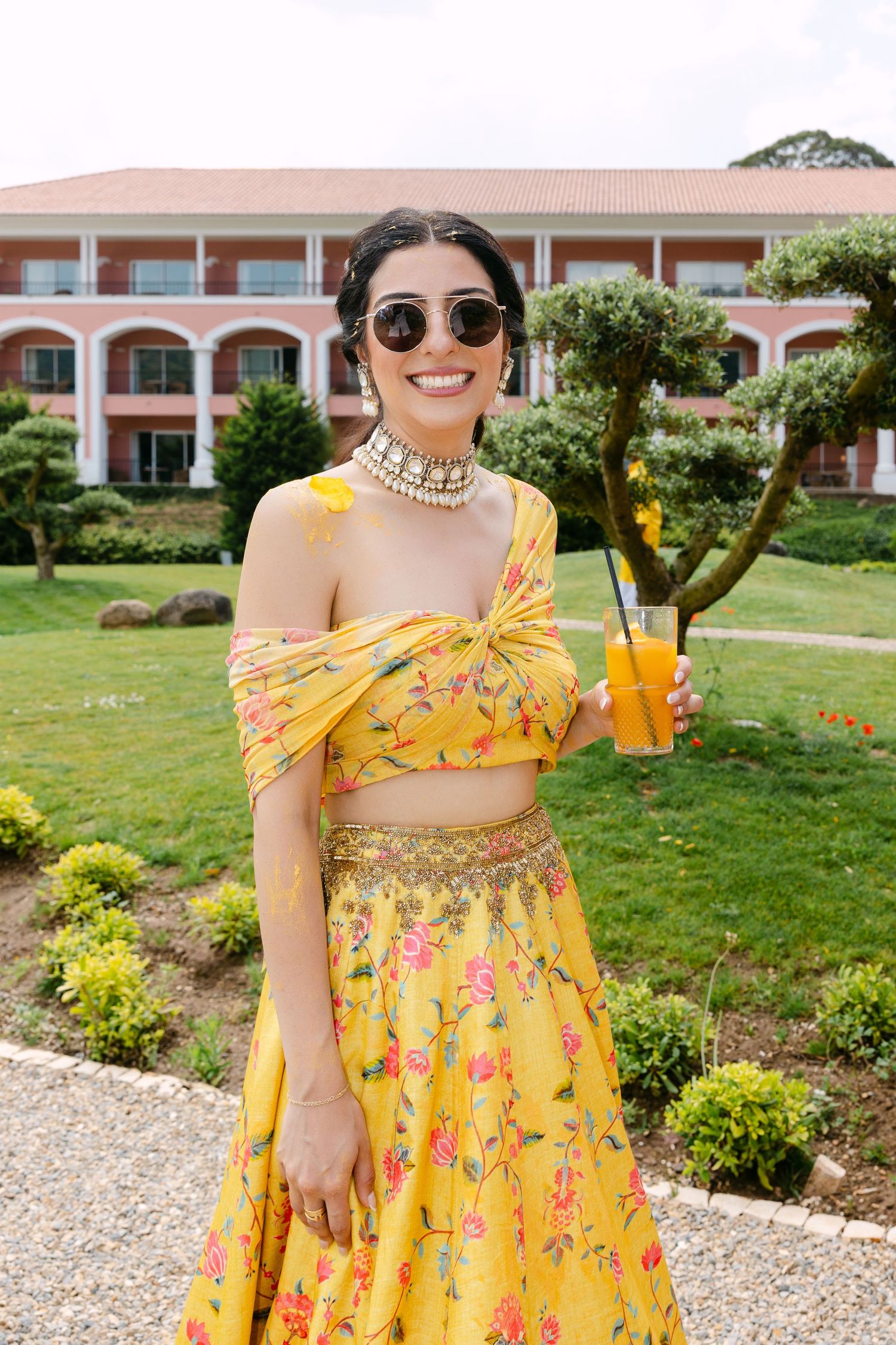 Bright yellow floral dress with delicate details shown in multiple close-up views.