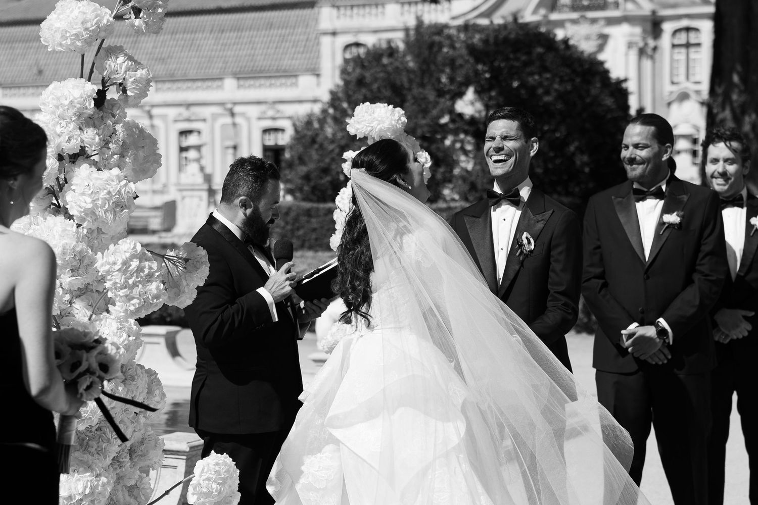Black and white photo series of wedding party celebrating outdoors.