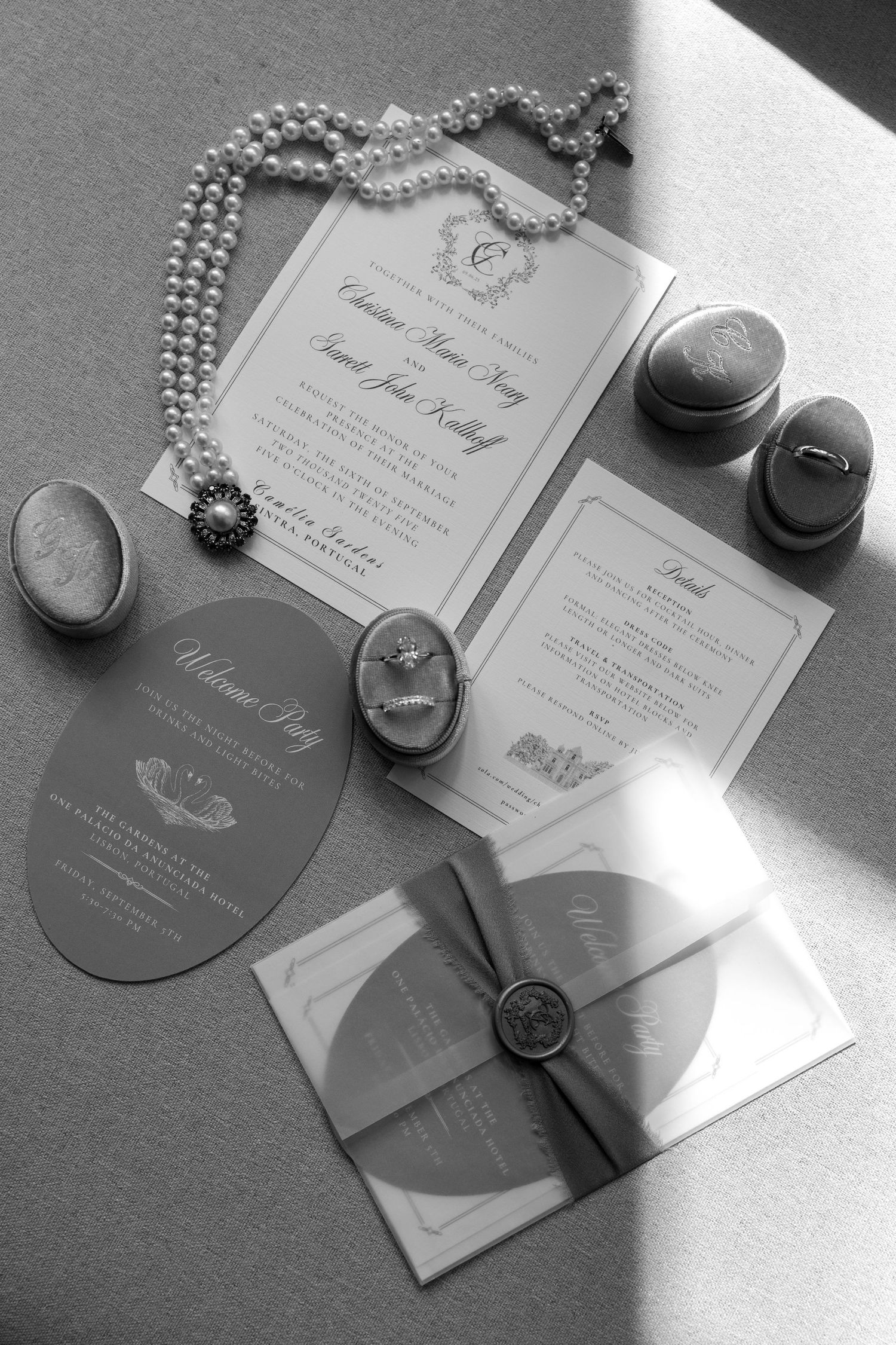 Wedding invitation suite with pearl necklace and vintage-style cameo details in black and white.