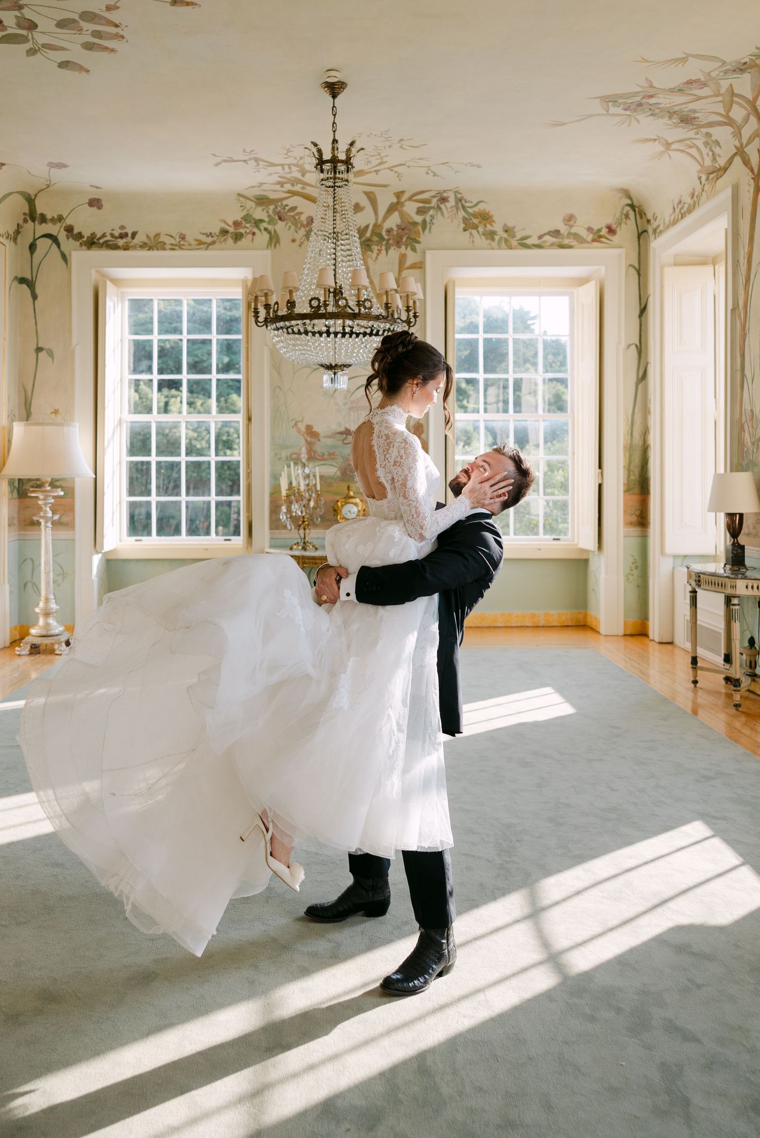 Romantic dance sequence in sunlit ballroom with ornate wall details.