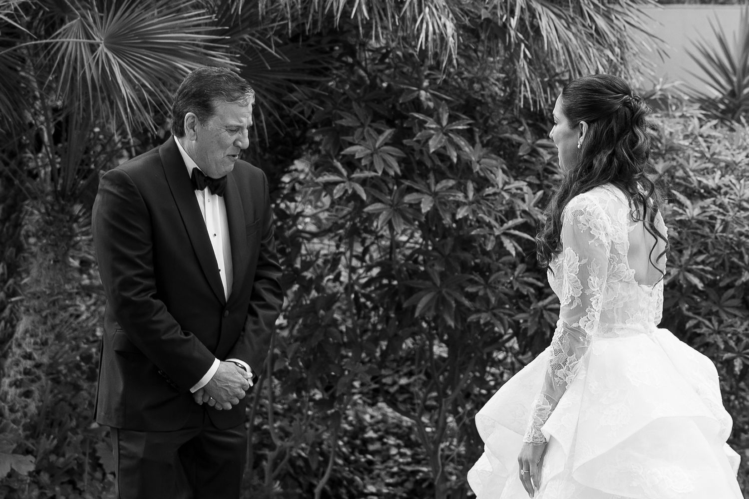 Wedding couple shares intimate moments during outdoor photo session.