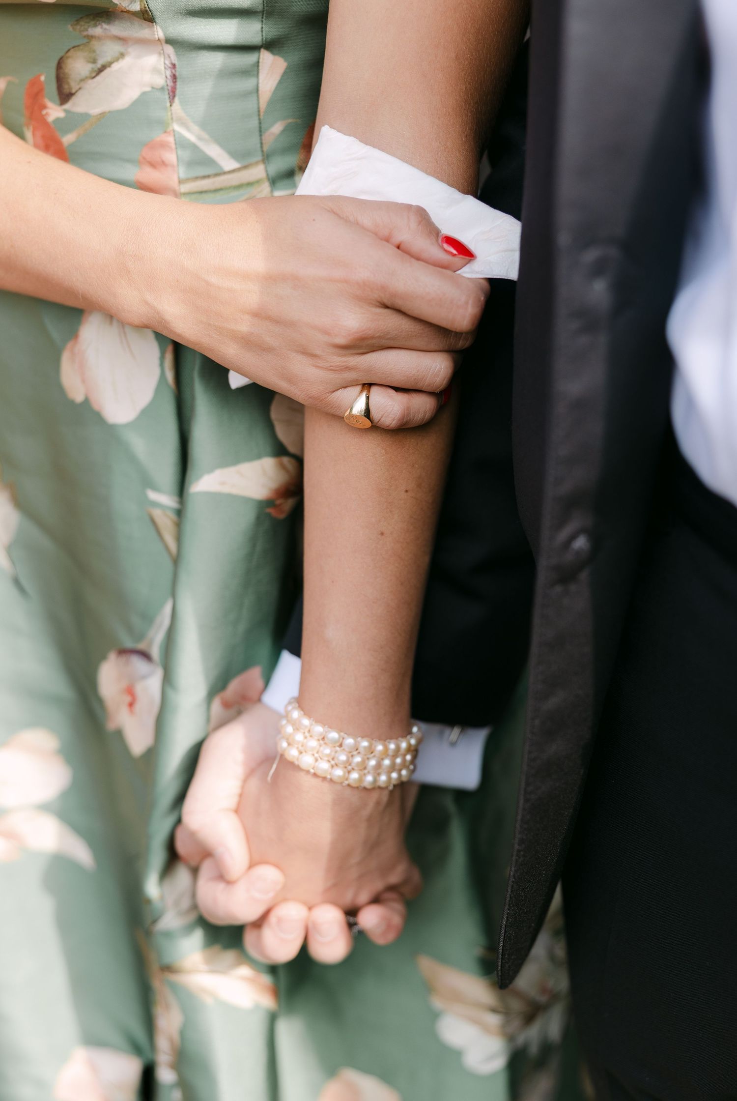 Sequence showing hands holding and exchanging notes during a wedding ceremony.