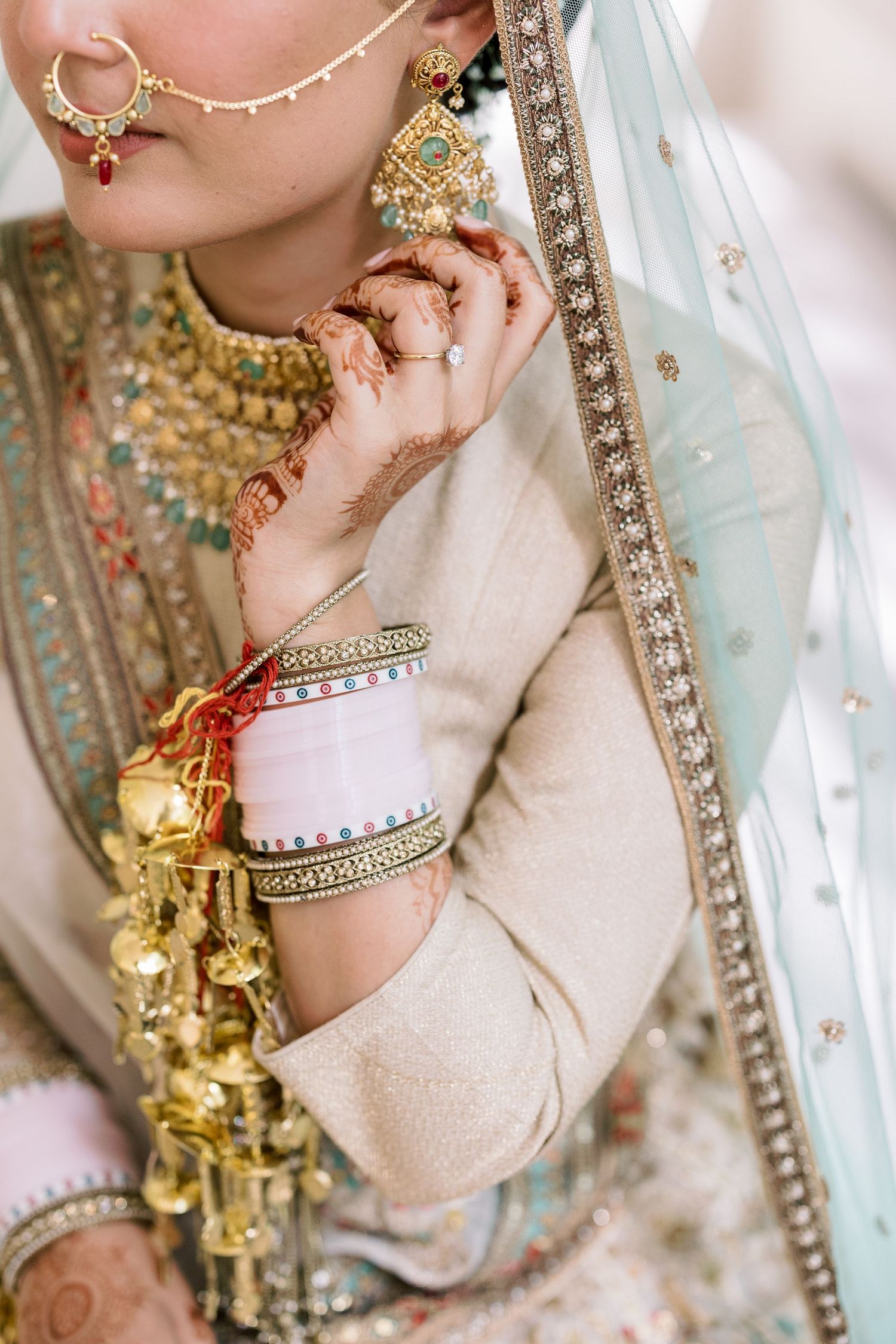 Close-up shots of traditional Indian bridal jewelry and henna-adorned hands.