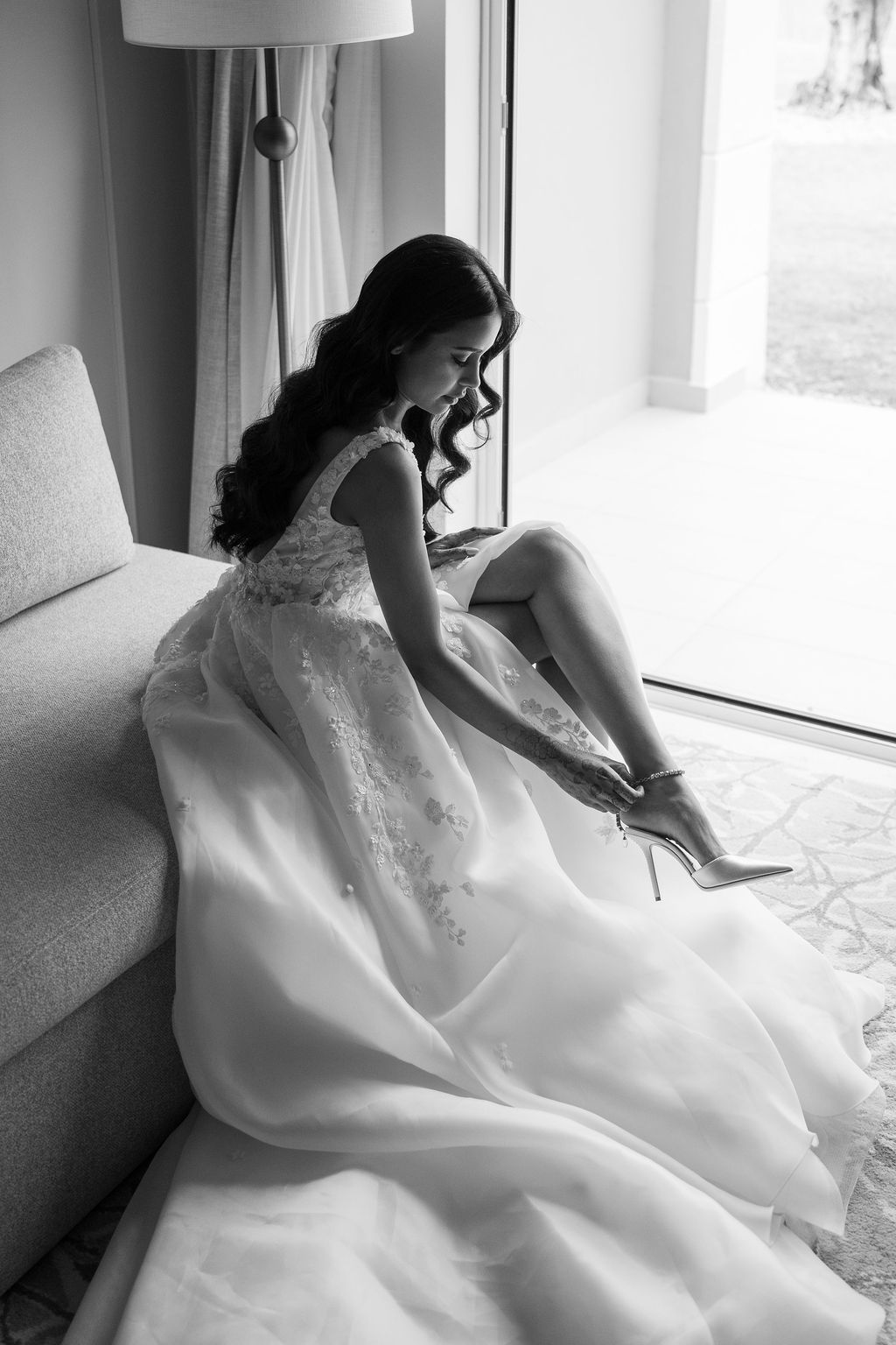 Wedding dress preparation sequence showing details of white gown and shoes.
