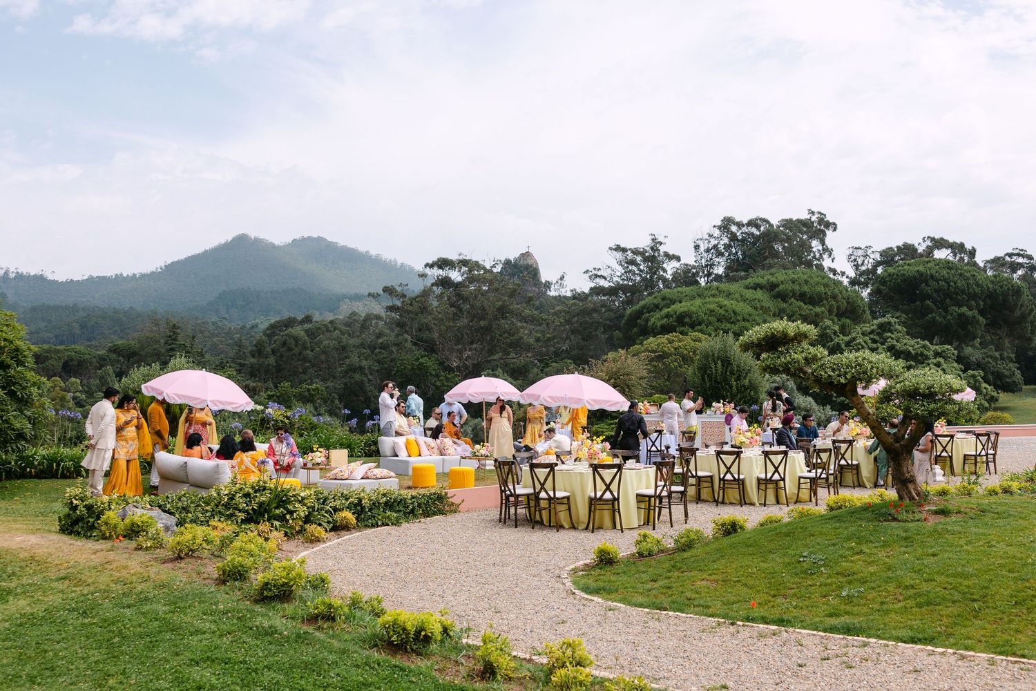 Panoramic view of an outdoor event setup against mountain landscape.
