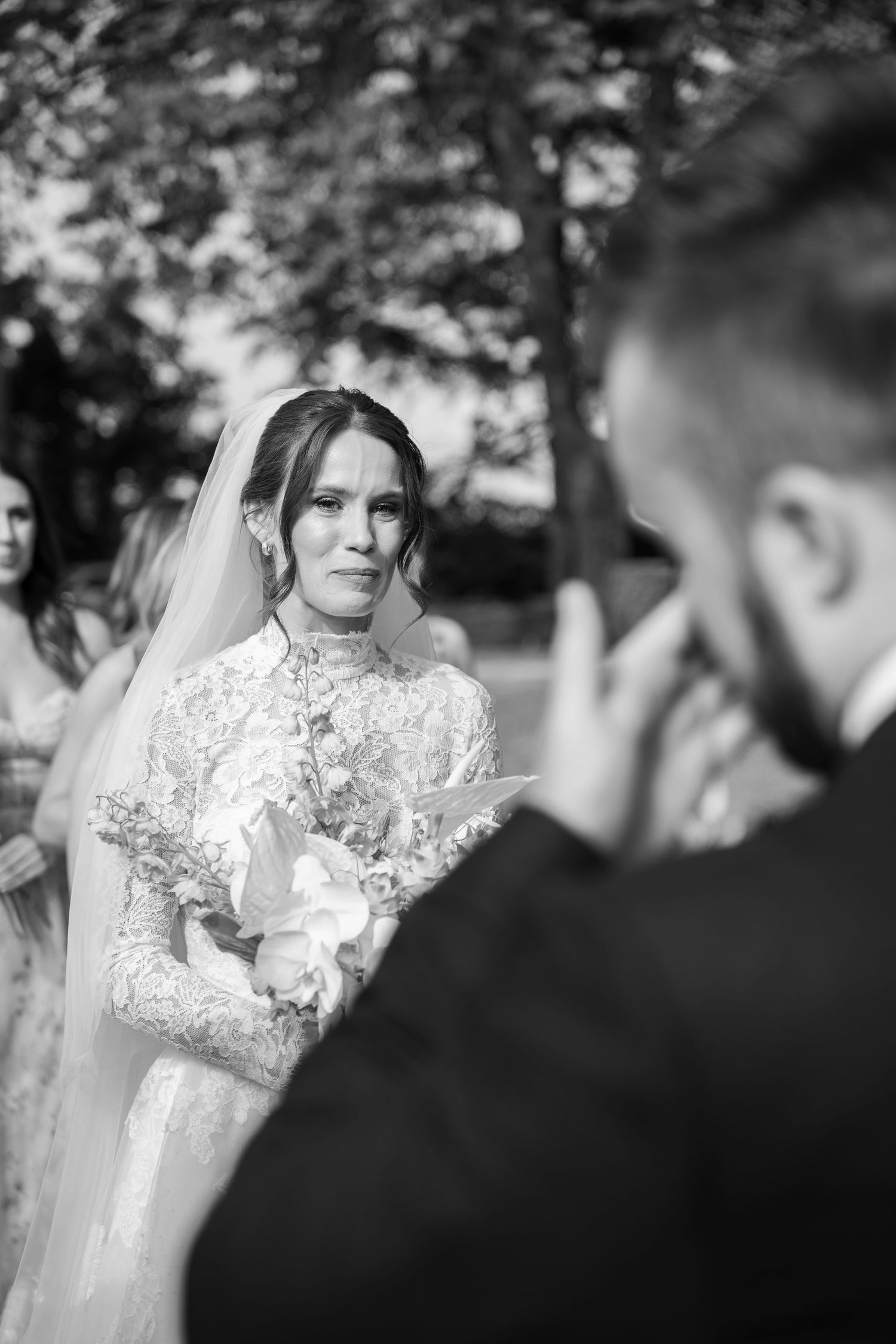 A wedding ceremony moment captured in black and white photography.