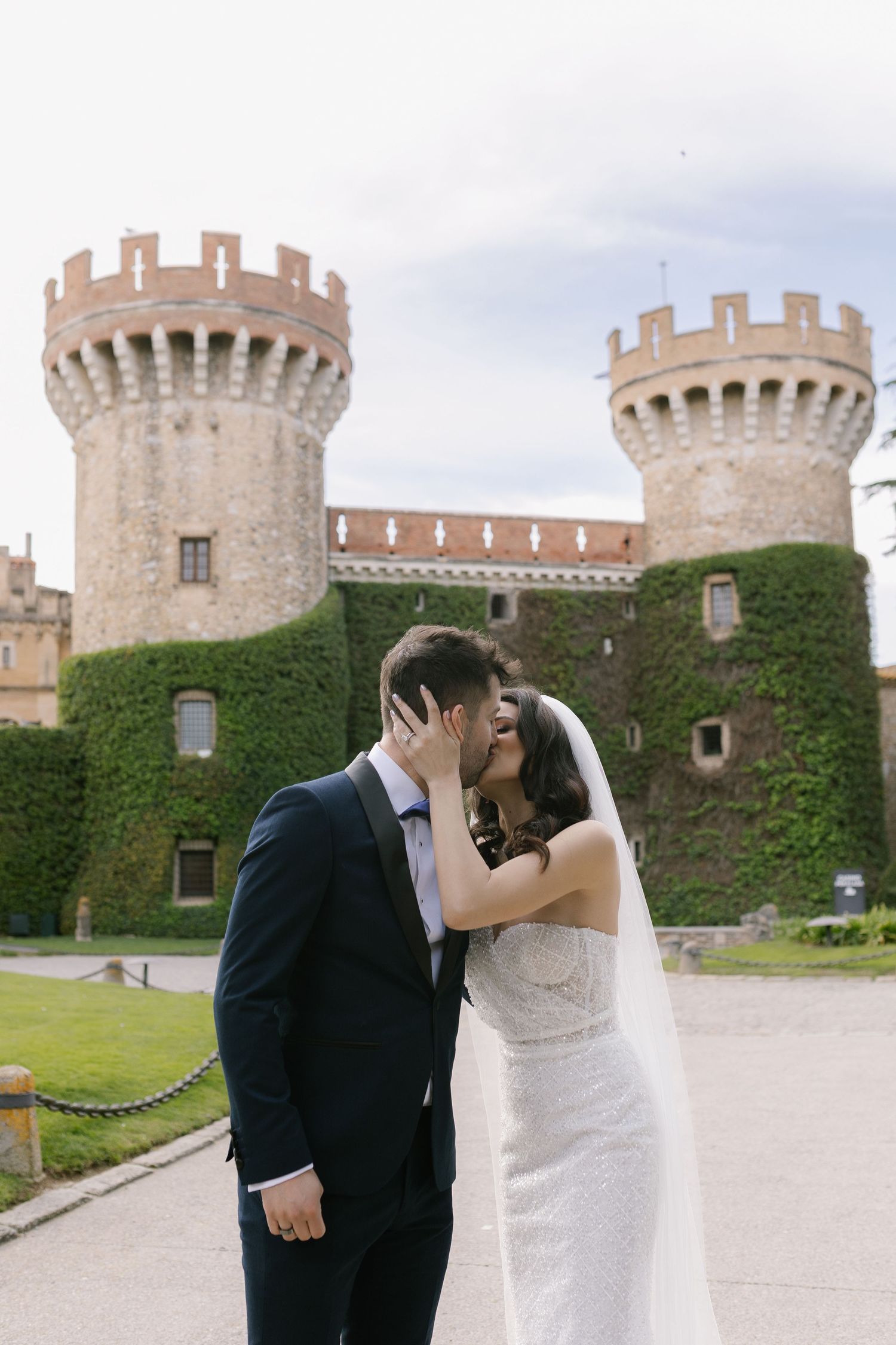 Romantic wedding photography sequence captured against stone castle walls and turrets.