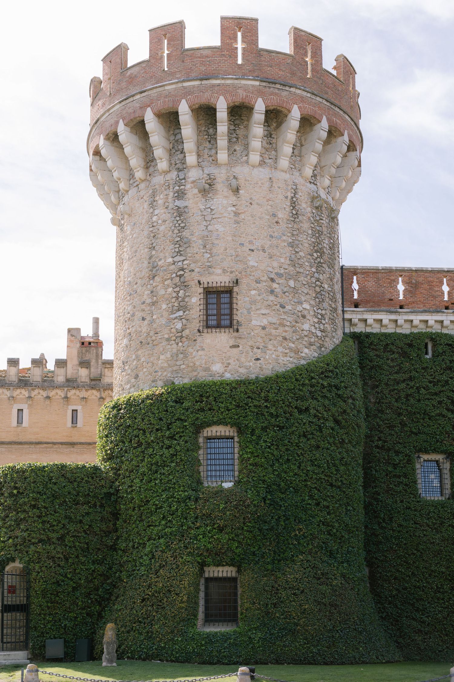 Stone castle wall with ivy coverage and ornate turrets photographed in sequence.