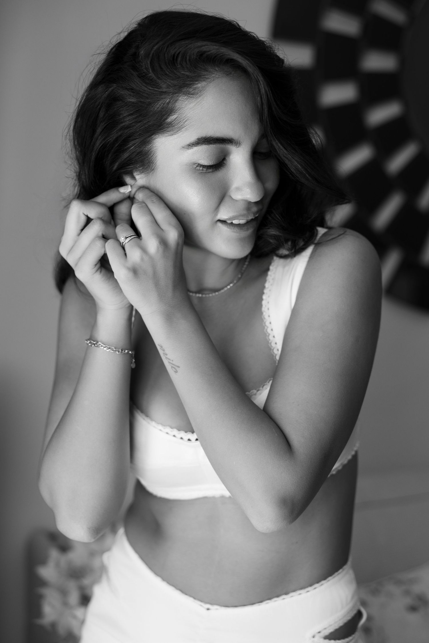 Artistic black and white portrait in intimate boudoir style.