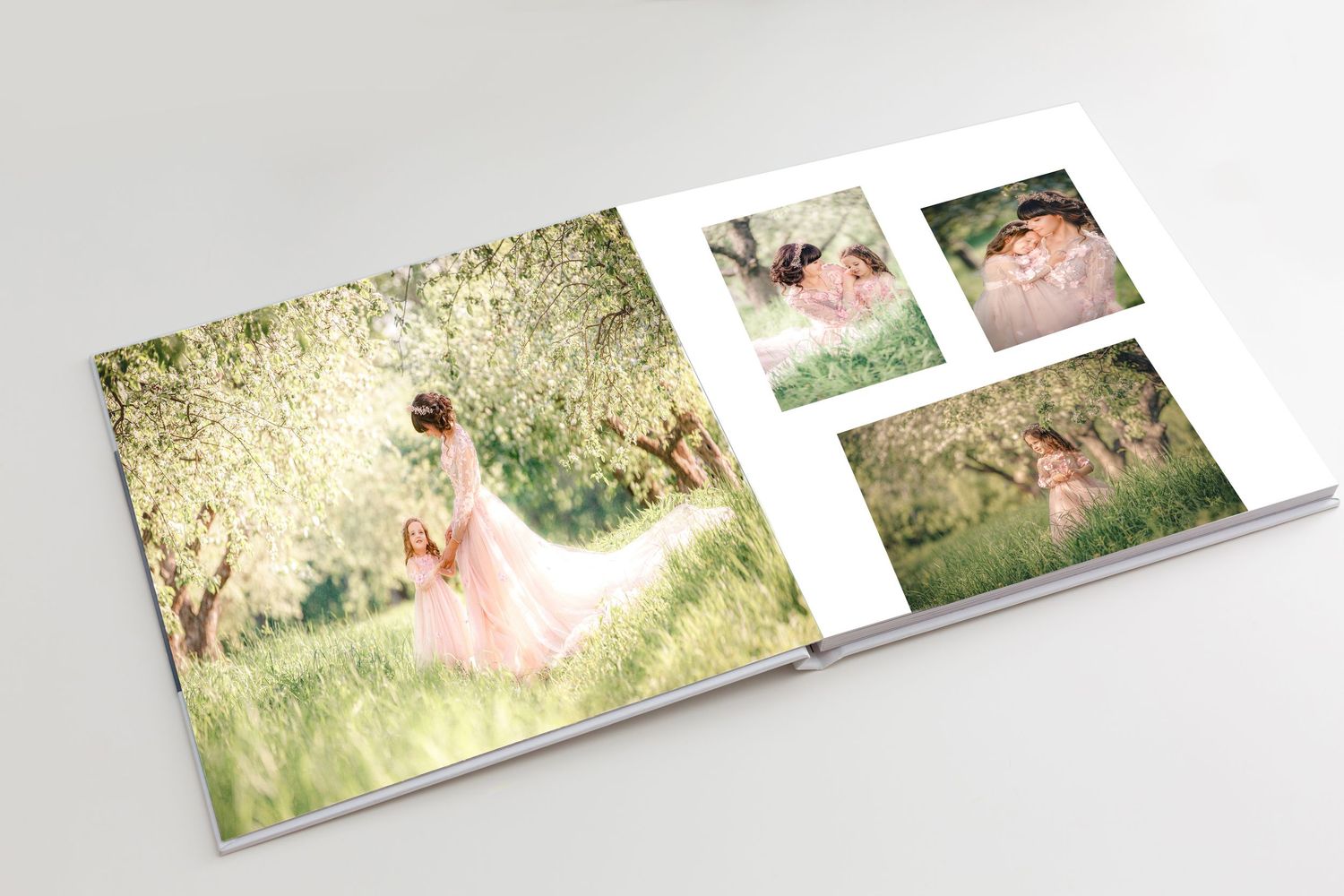 Open photo album displaying a woman in a pink dress among blooming trees, with three smaller portrait photos on the right page.