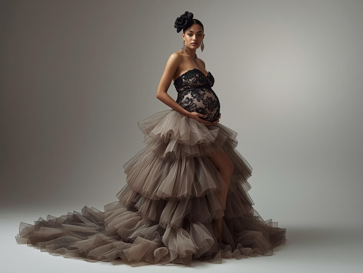 Fashion portrait series in flowing tulle gown against neutral studio backdrop.
