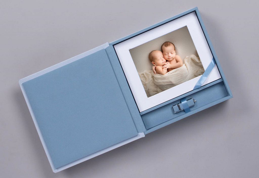 Light blue keepsake box with matted newborn twins photo and satin ribbon, elegant baby photo storage gift.