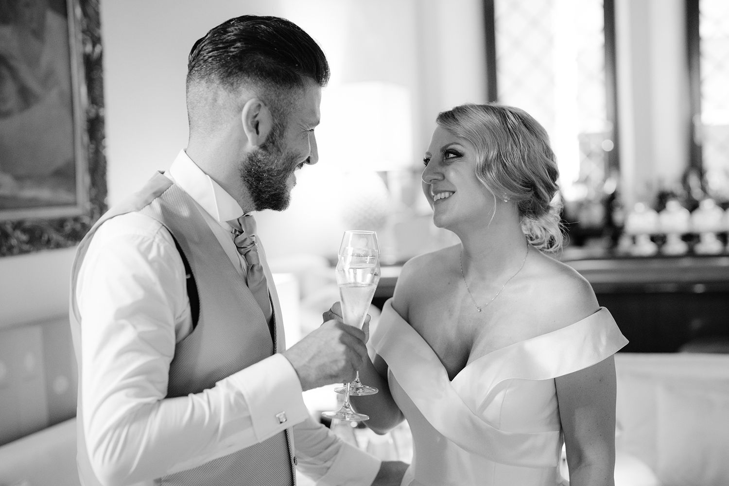 Candid black and white wedding photos capturing intimate moments between a couple.