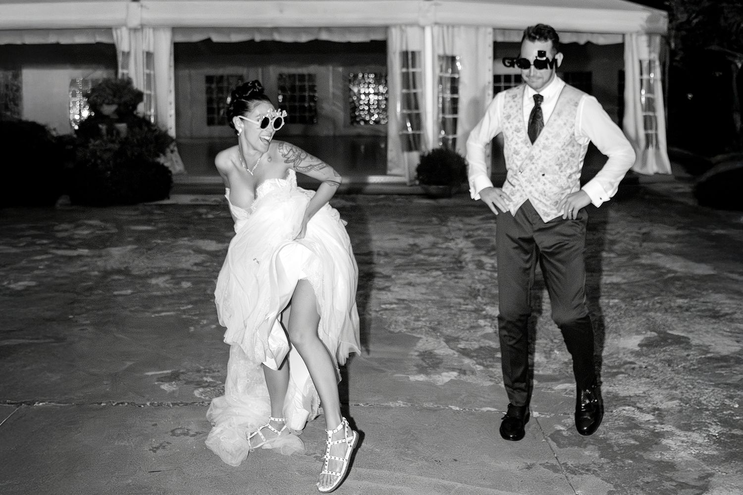 Black and white images showing wedding guests dancing on a reception dance floor.