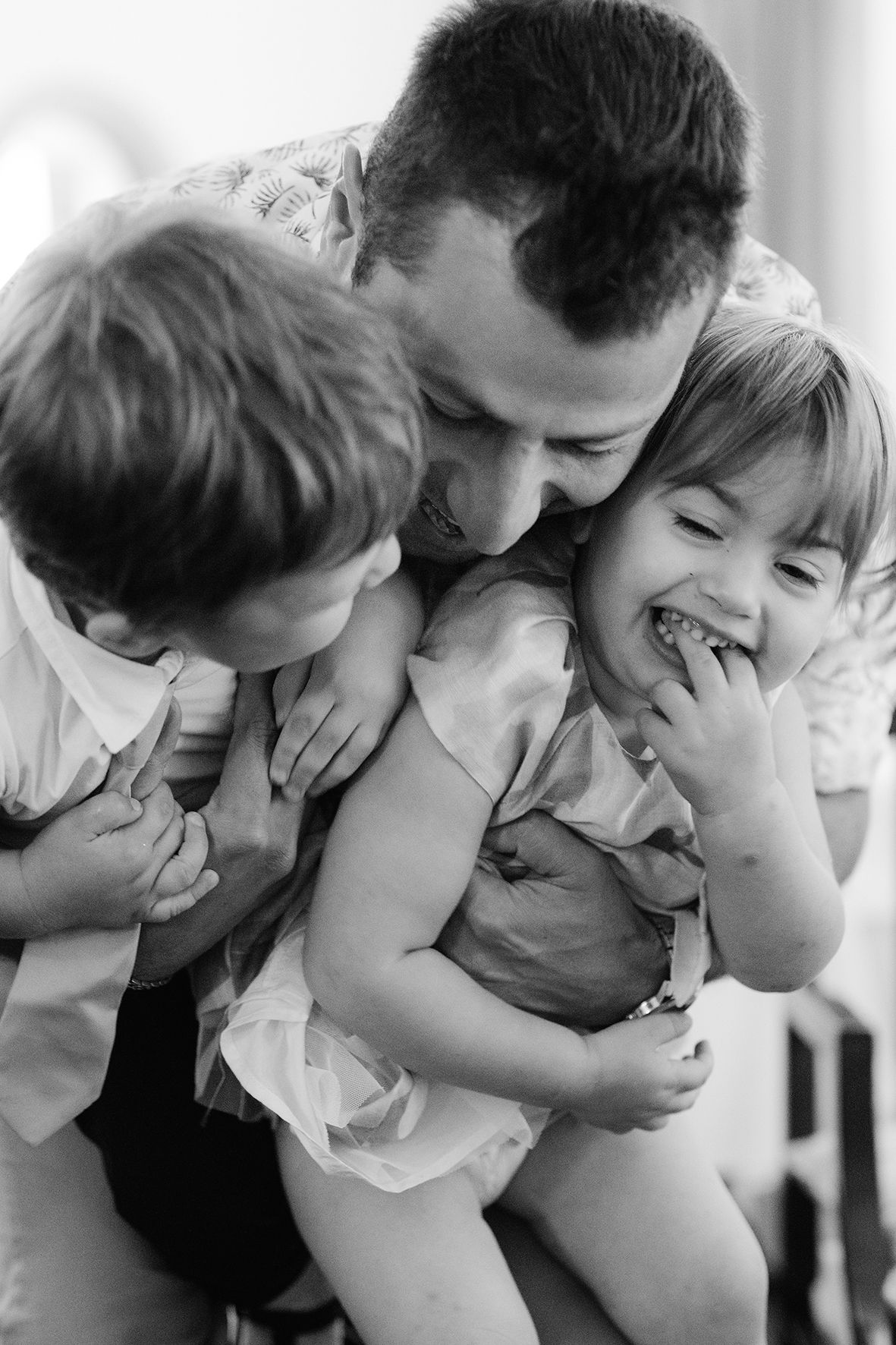 Black and white sequence of children playing and making silly faces.
