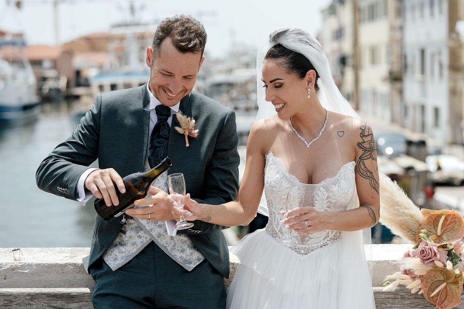 Wedding couple shares intimate moments in an elegant outdoor setting.