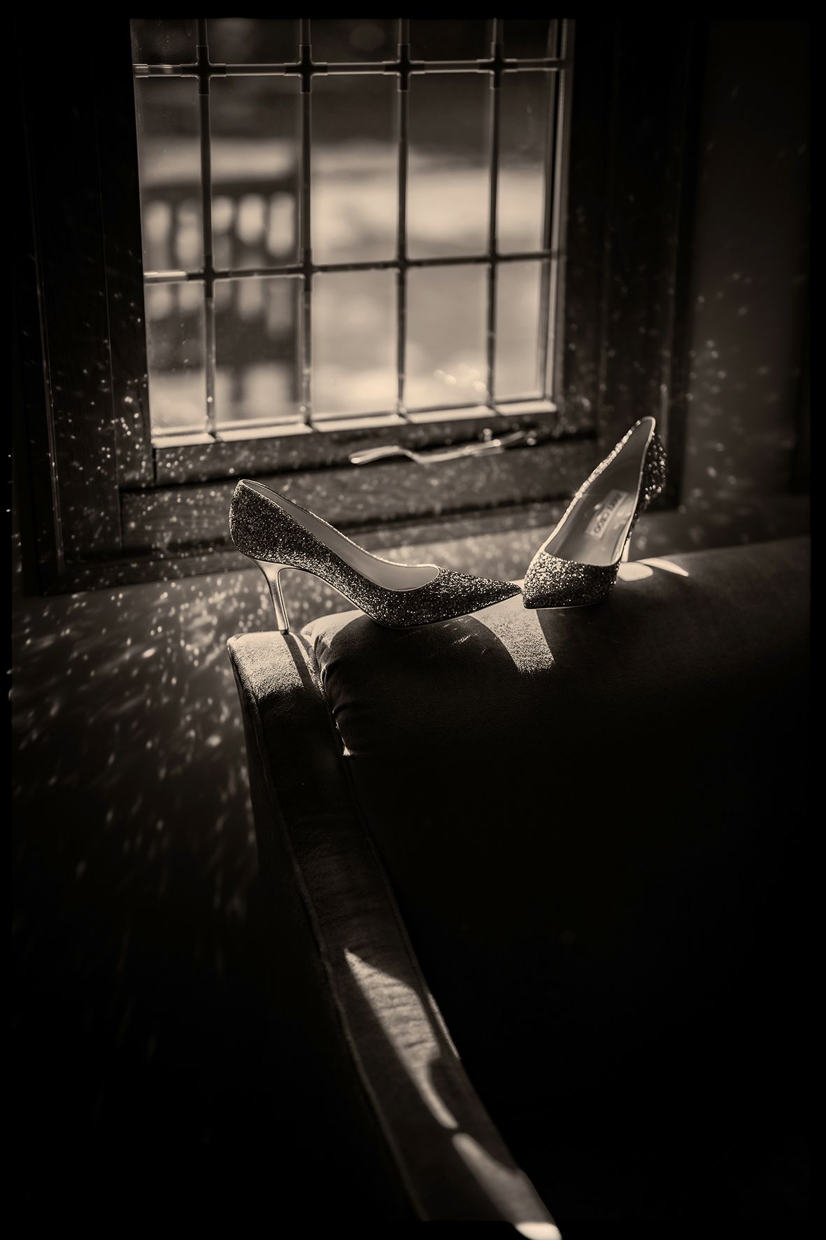 A dark and moody sequence of photographs showing a hammer breaking through glass in dramatic lighting.