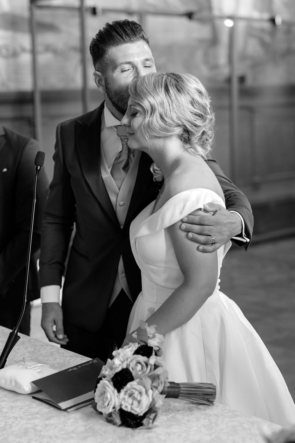 Romantic black and white wedding photos showing tender moments between newlyweds.