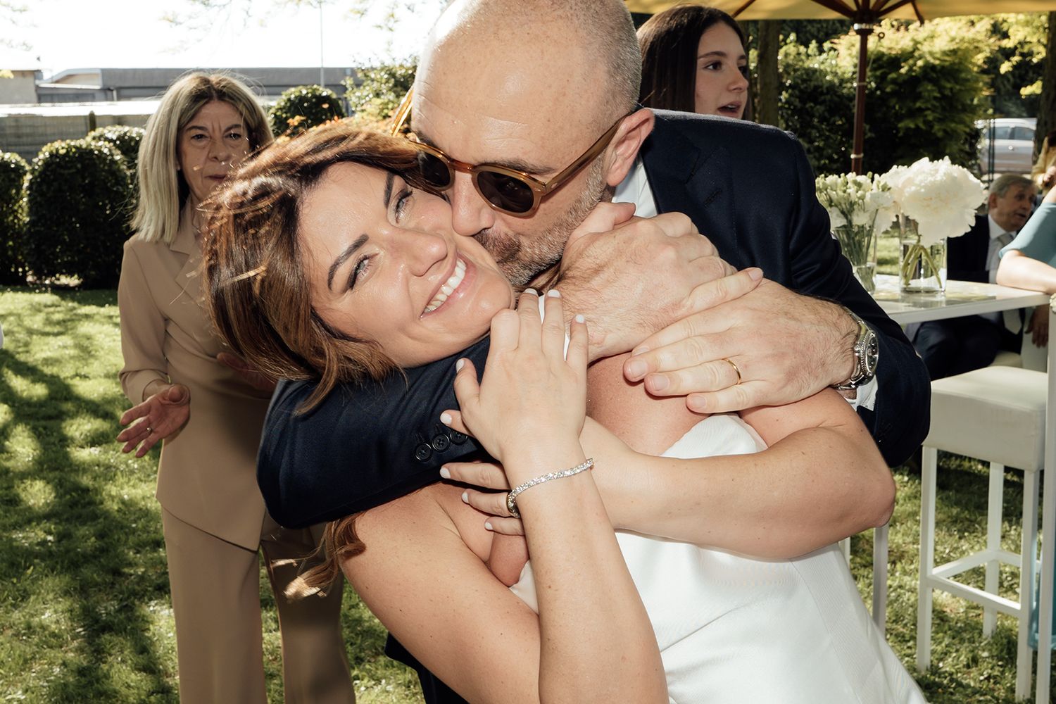 Joyful celebration moments captured during outdoor wedding festivities.